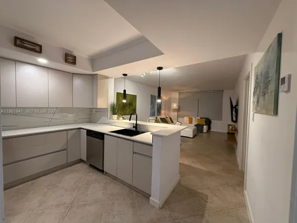 a kitchen with counter top space and sink
