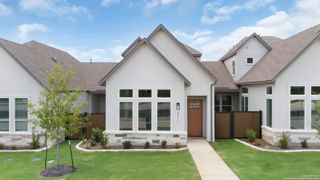 a front view of a house with a yard and porch