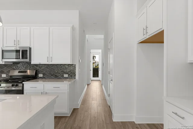 a view of entryway with wooden floor