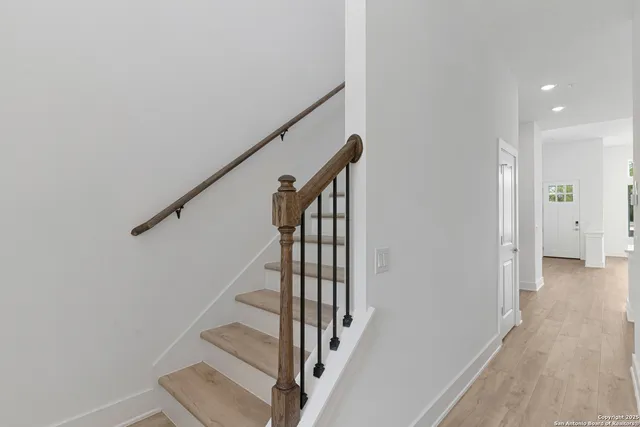 a view of a hallway with stairs
