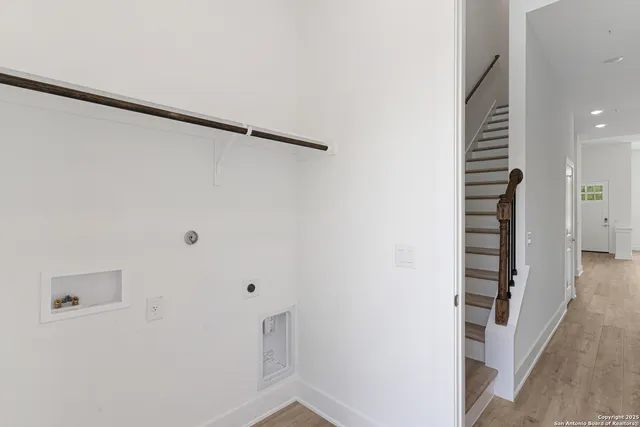 a white toilet sitting next to a bathroom sink