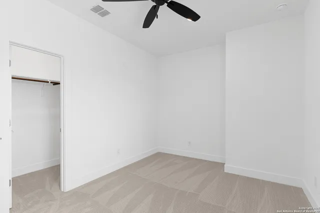 an empty room with a empty space and windows