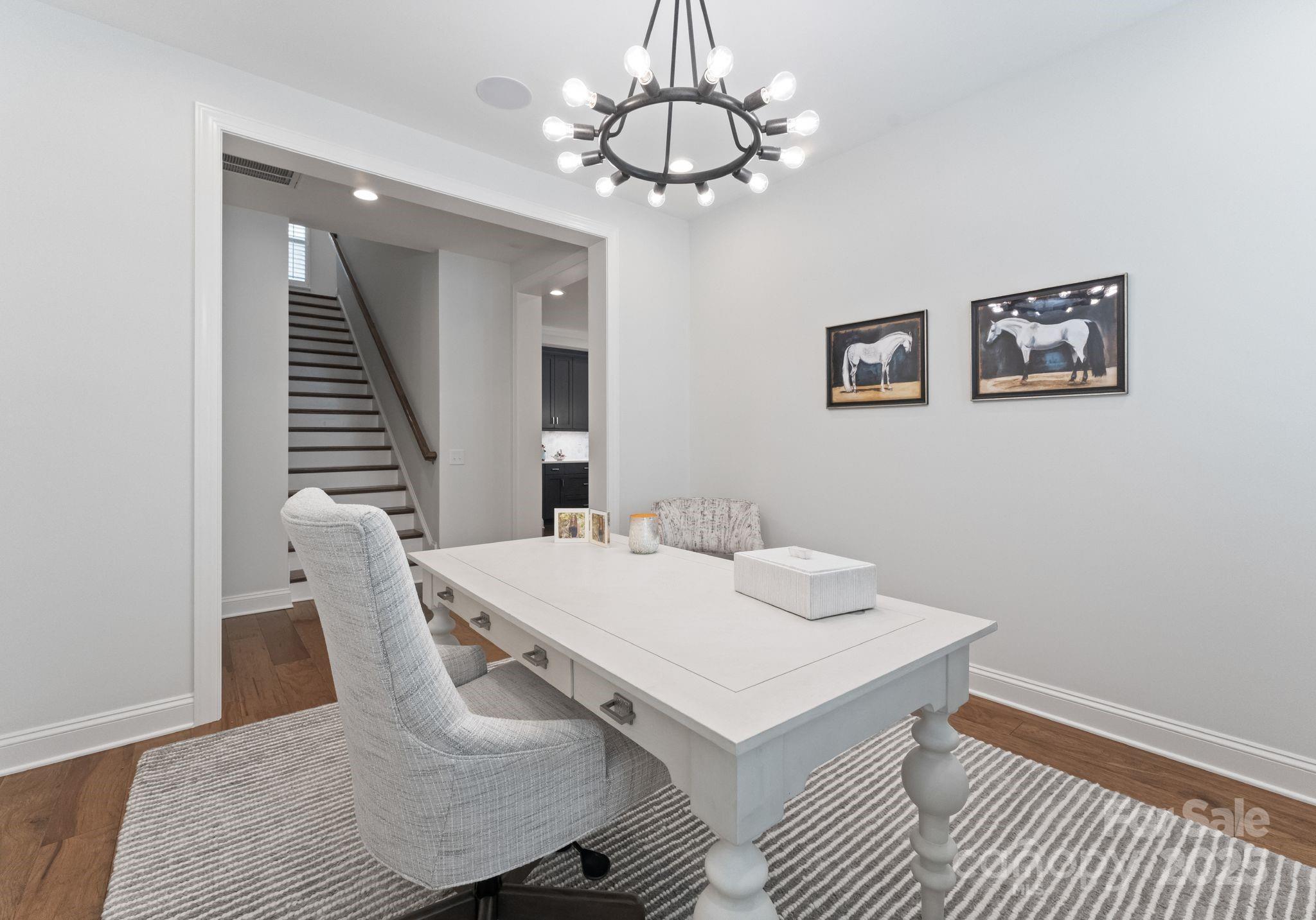 12019 Huntson Reserve Road Huntersville, NC 28078 - Photo 11 of 43 a view of a dining room with furniture and wooden floor