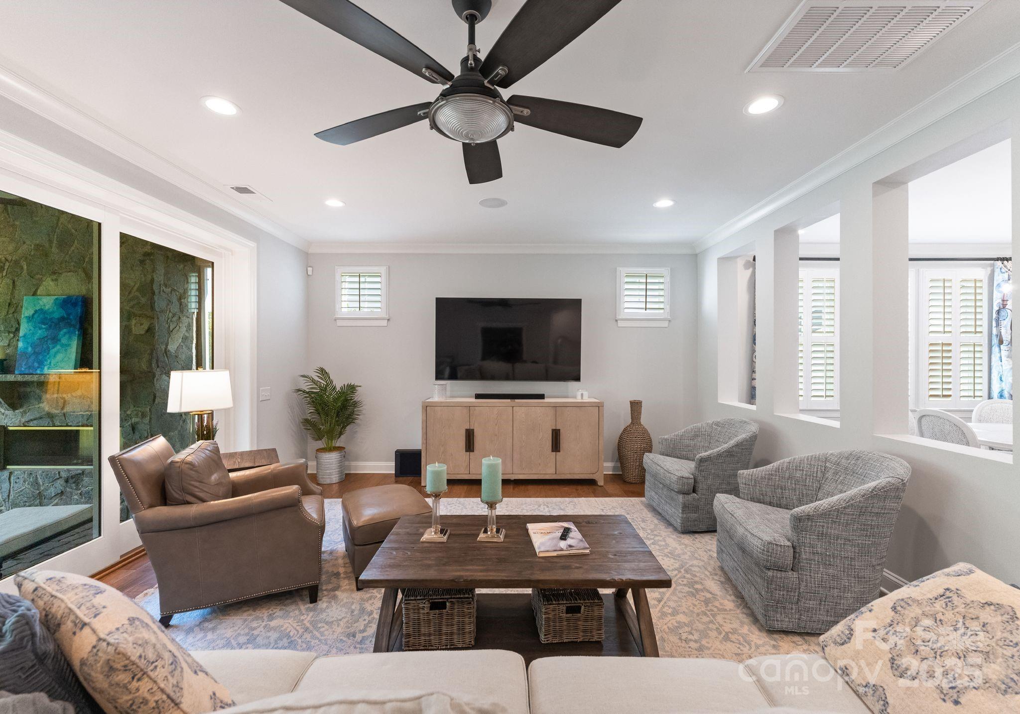 12019 Huntson Reserve Road Huntersville, NC 28078 - Photo 12 of 43 a living room with furniture and a flat screen tv
