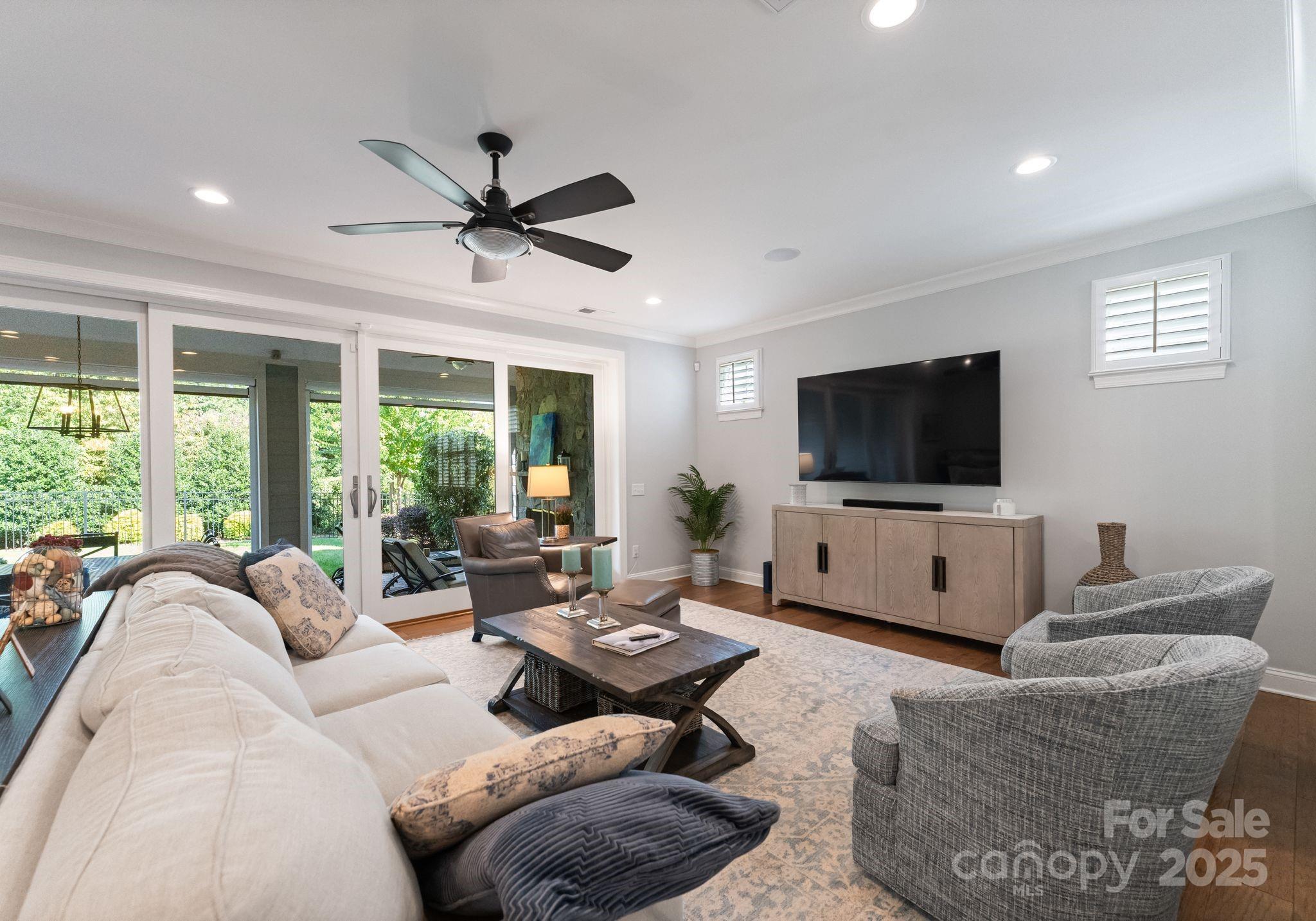 12019 Huntson Reserve Road Huntersville, NC 28078 - Photo 13 of 43 a living room with furniture and a flat screen tv