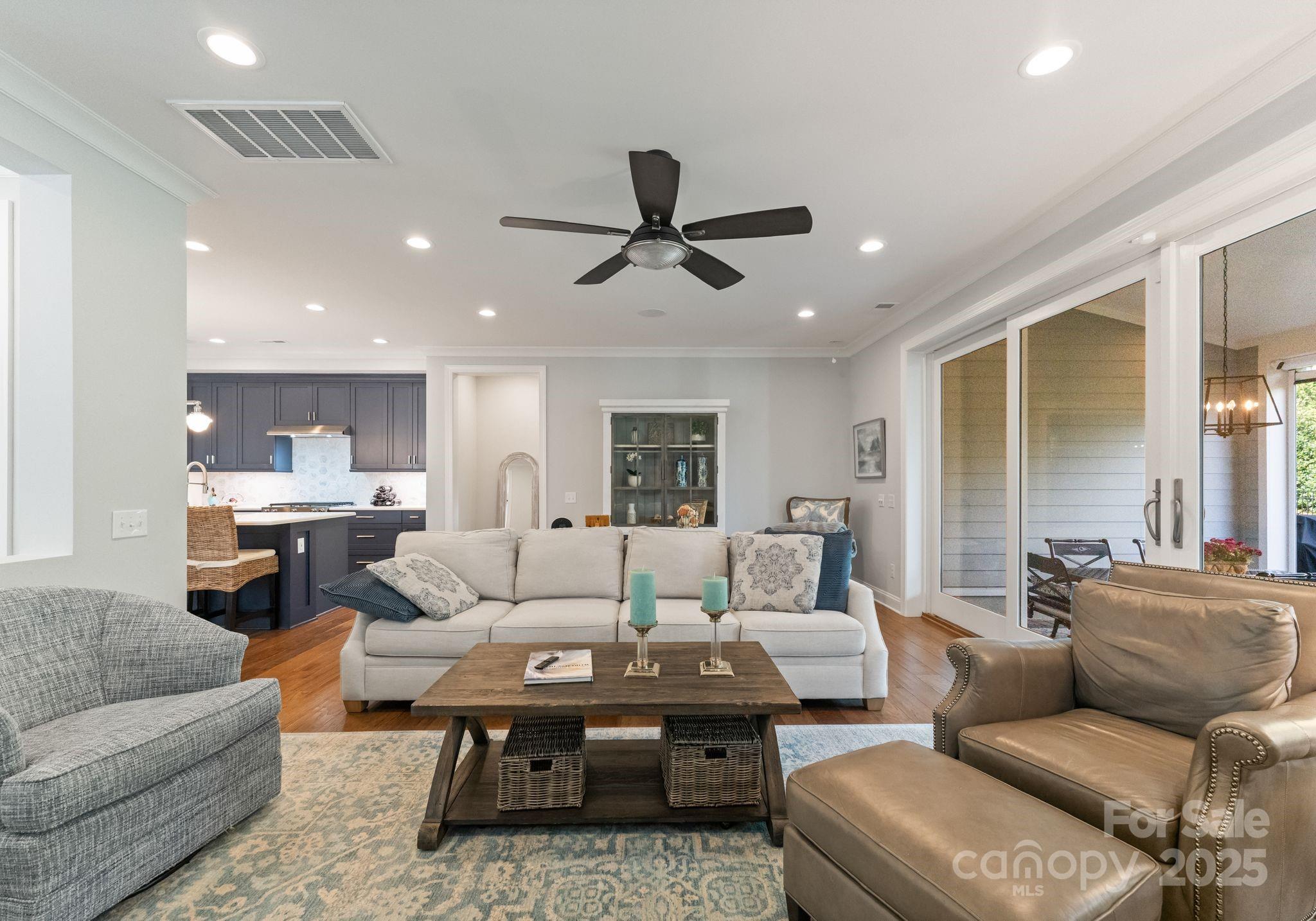 12019 Huntson Reserve Road Huntersville, NC 28078 - Photo 15 of 43 a living room with furniture ceiling fan and a rug