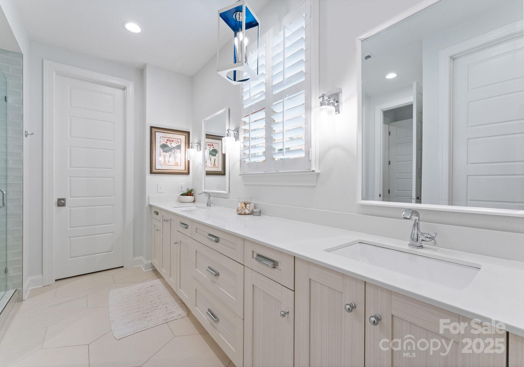 12019 Huntson Reserve Road Huntersville, NC 28078 - Photo 19 of 43 a bathroom with a sink double vanity and a mirror