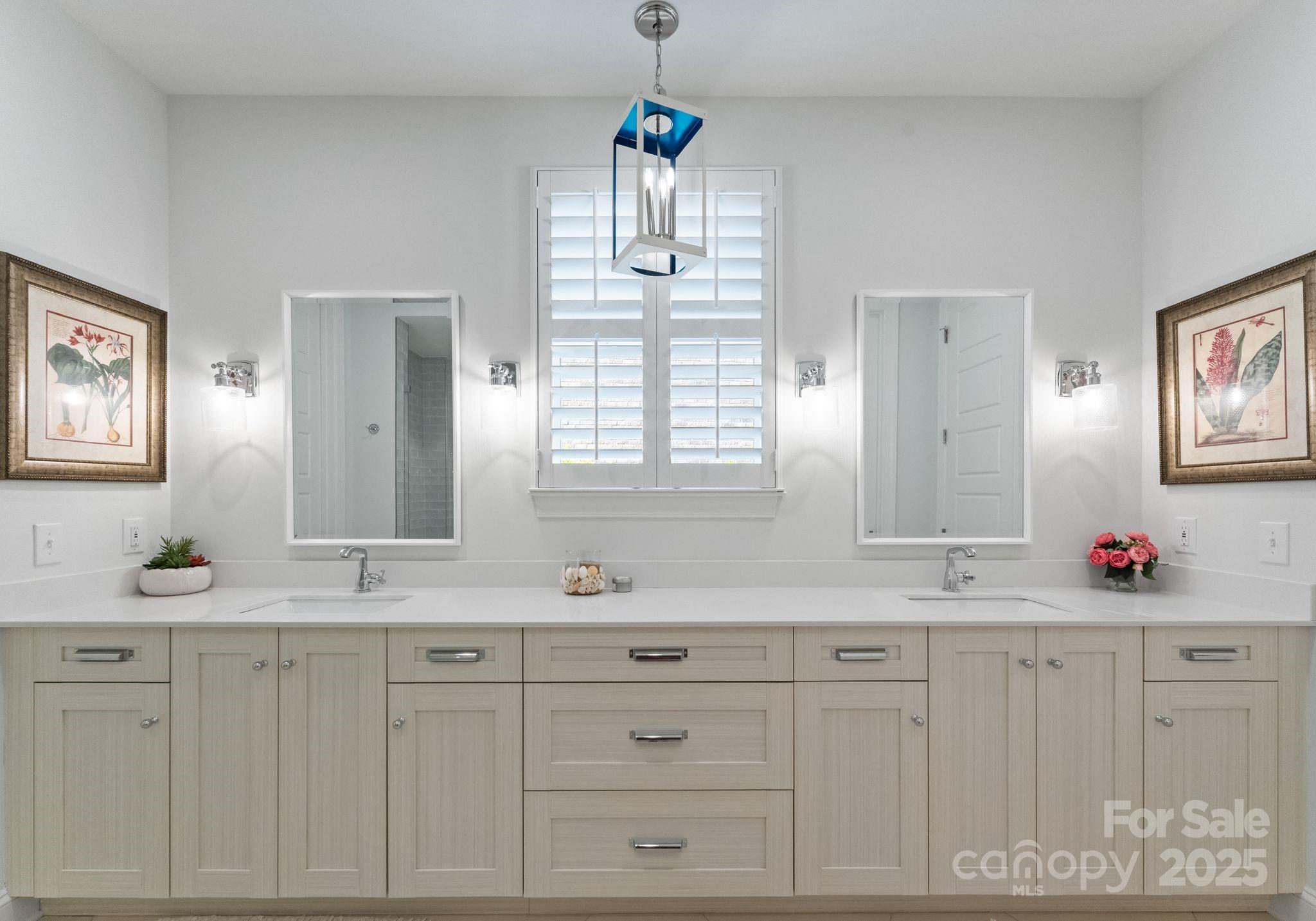 12019 Huntson Reserve Road Huntersville, NC 28078 - Photo 20 of 43 a bathroom with double vanity white cabinets and a window