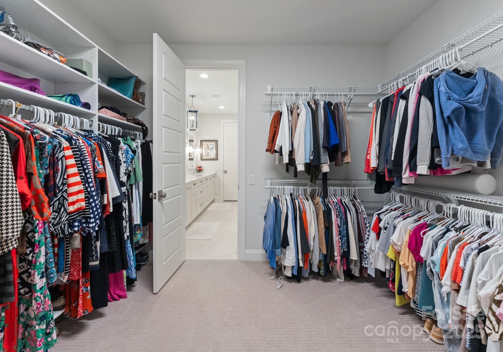 12019 Huntson Reserve Road Huntersville, NC 28078 - Photo 23 of 43 a view of walk in closet with clothes