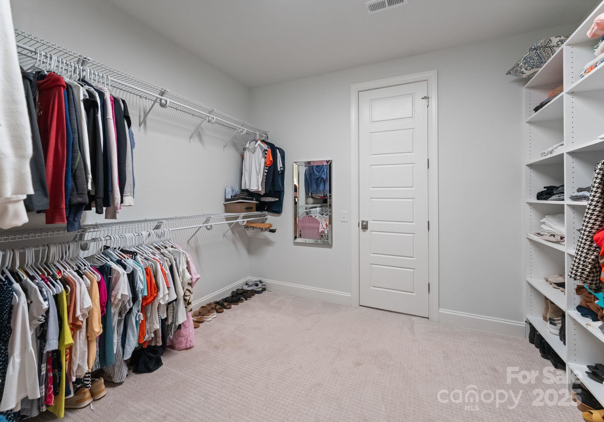 12019 Huntson Reserve Road Huntersville, NC 28078 - Photo 24 of 43 a view of walk in closet with clothes and shoes