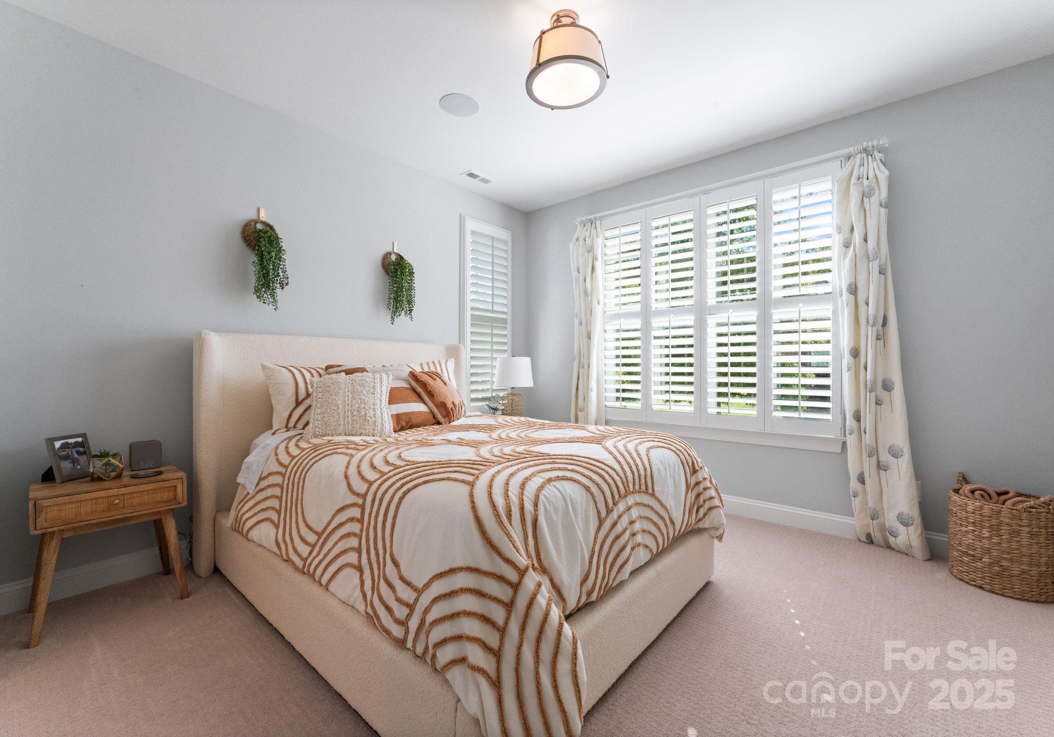 12019 Huntson Reserve Road Huntersville, NC 28078 - Photo 26 of 43 a bedroom with bed and a window