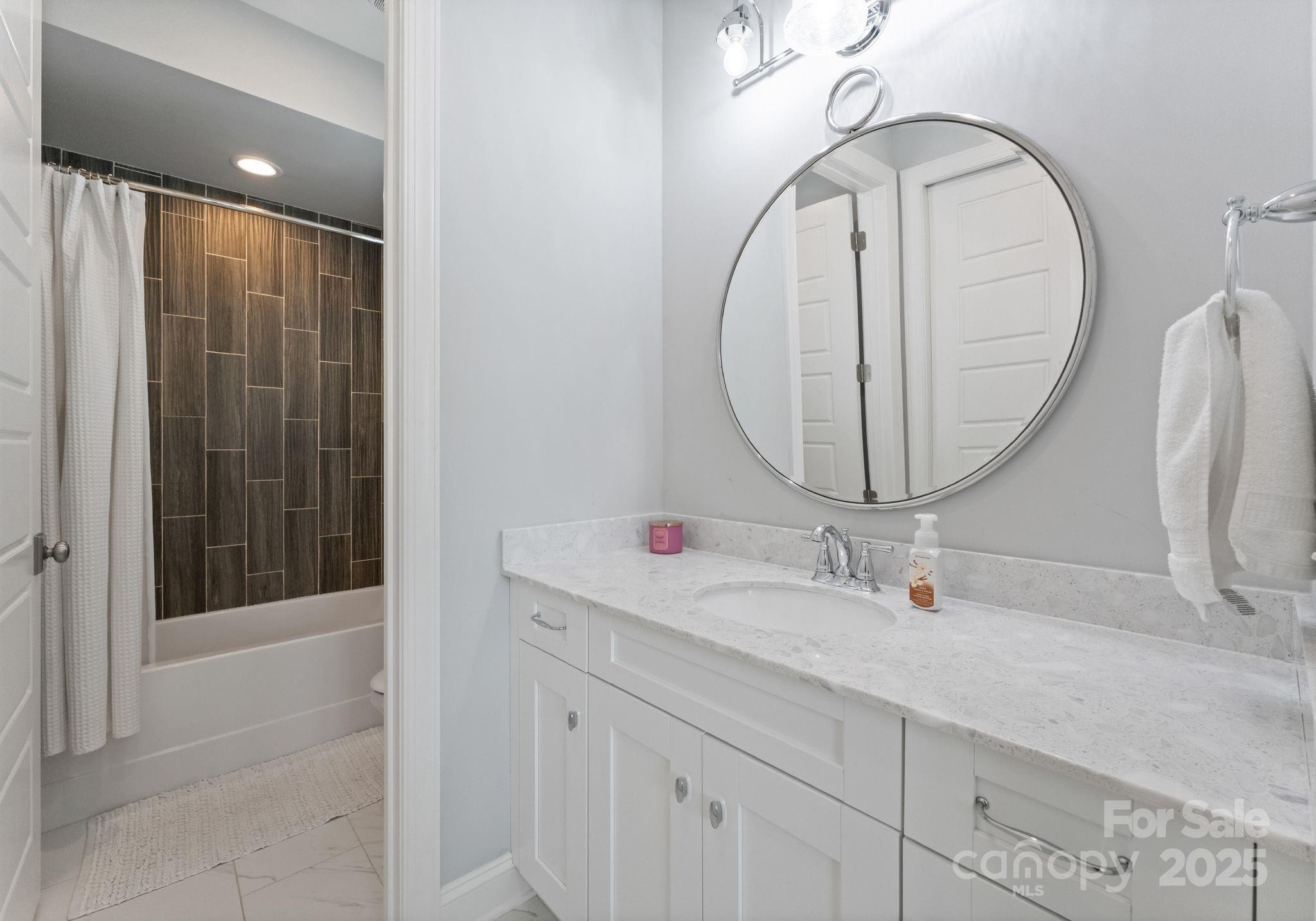 12019 Huntson Reserve Road Huntersville, NC 28078 - Photo 27 of 43 a bathroom with a sink and a mirror