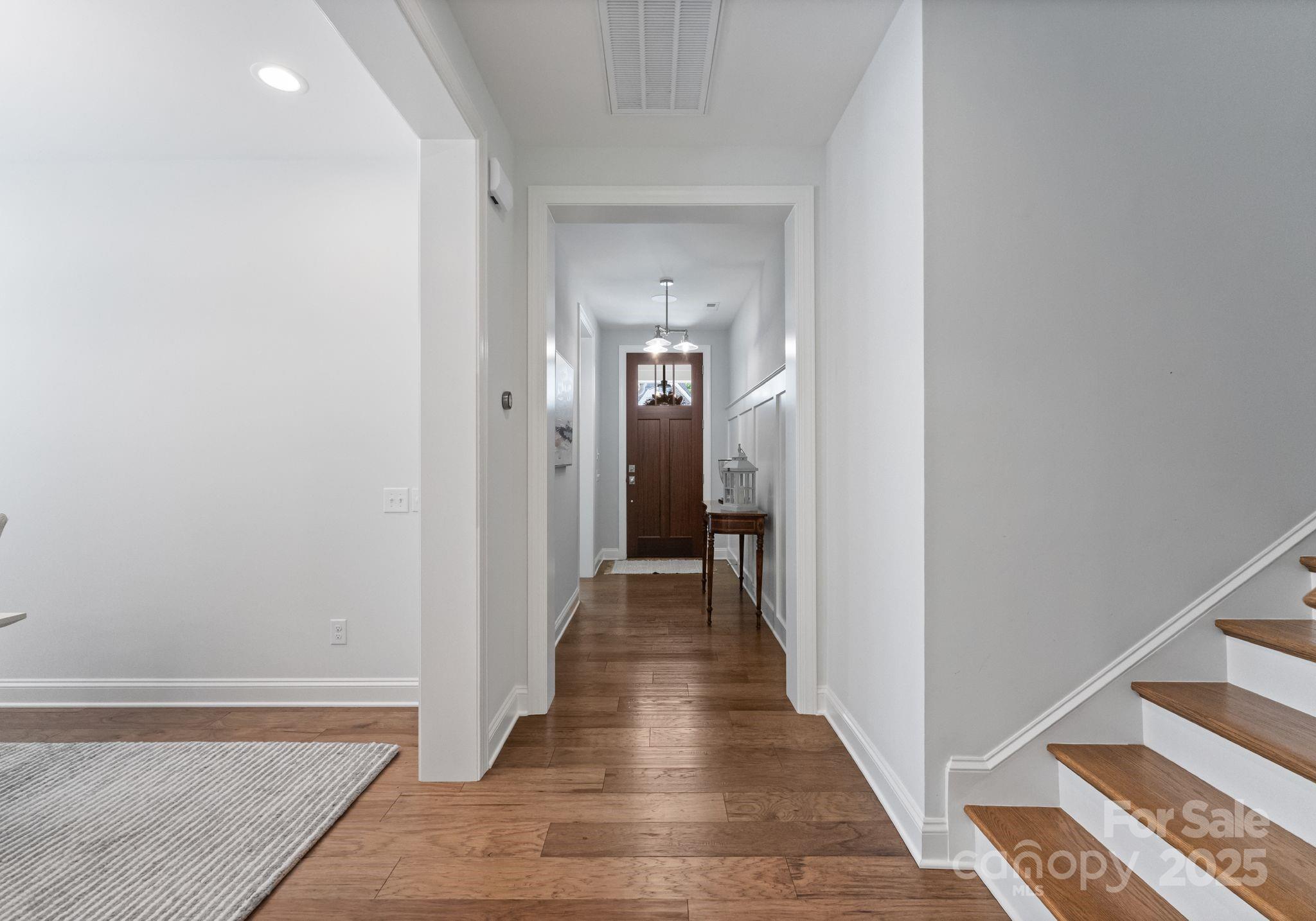 12019 Huntson Reserve Road Huntersville, NC 28078 - Photo 3 of 43 a view of a hallway with wooden floor and a bathroom