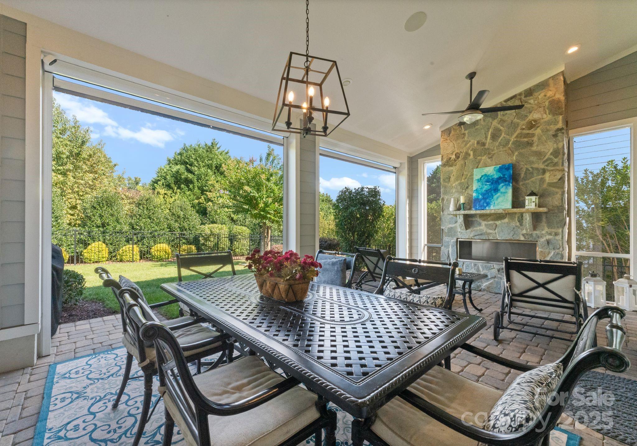 12019 Huntson Reserve Road Huntersville, NC 28078 - Photo 37 of 43 a view of a dining room with furniture wooden floor and a chandelier