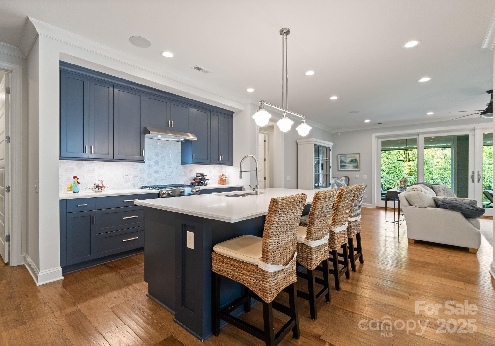 12019 Huntson Reserve Road Huntersville, NC 28078 - Photo 5 of 43 a large kitchen with kitchen island granite countertop lots of white cabinets appliances and furniture
