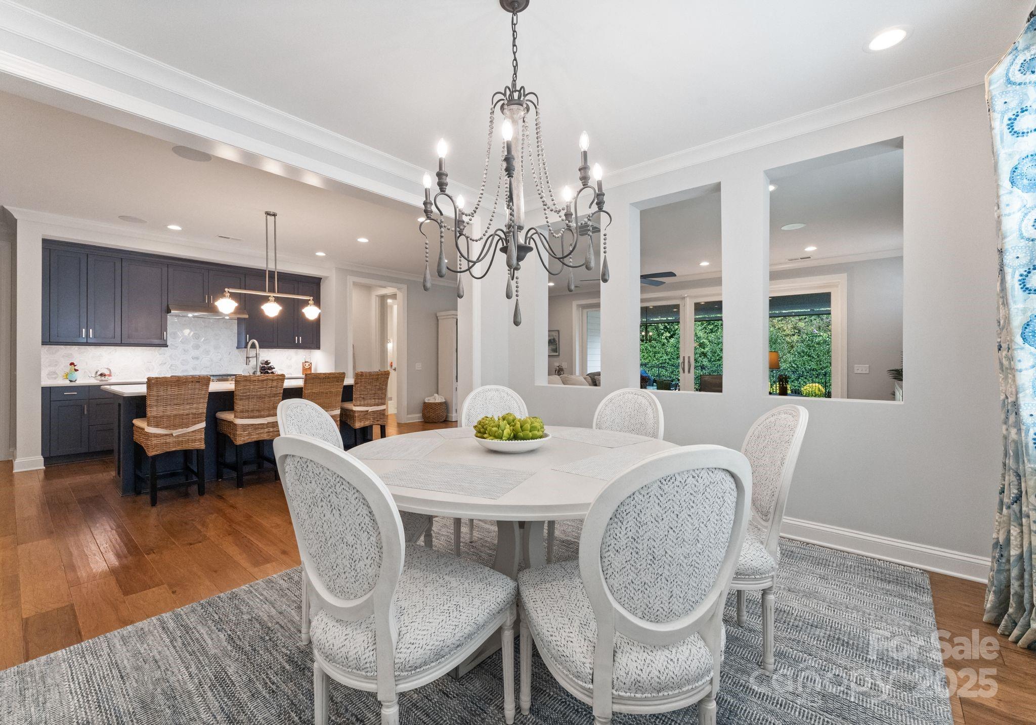 12019 Huntson Reserve Road Huntersville, NC 28078 - Photo 9 of 43 a view of a dining room with furniture window and wooden floor