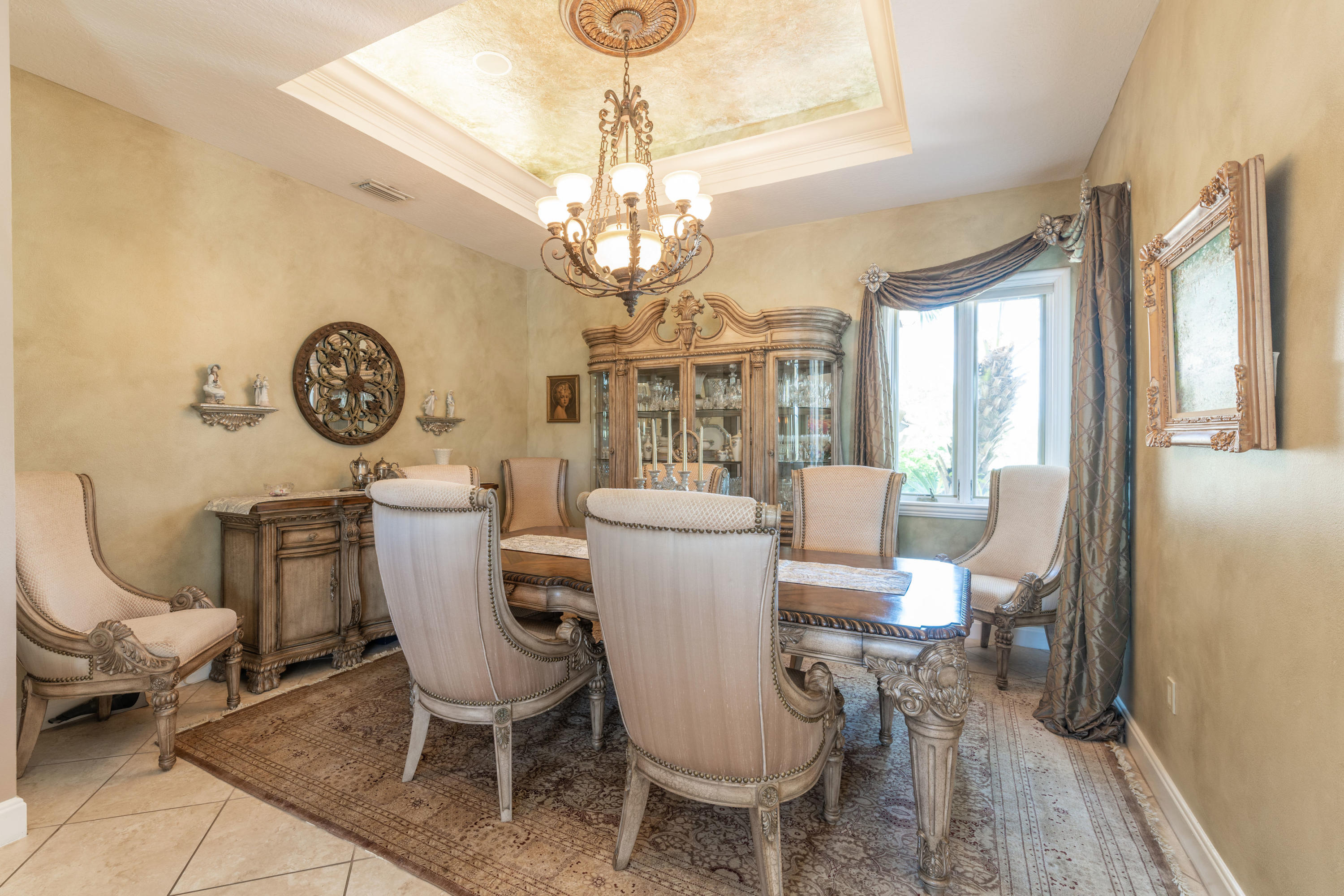 3835 Raney Road Titusville, FL 32780 - Photo 19 of 55 a view of a dining room with furniture a chandelier and wooden floor
