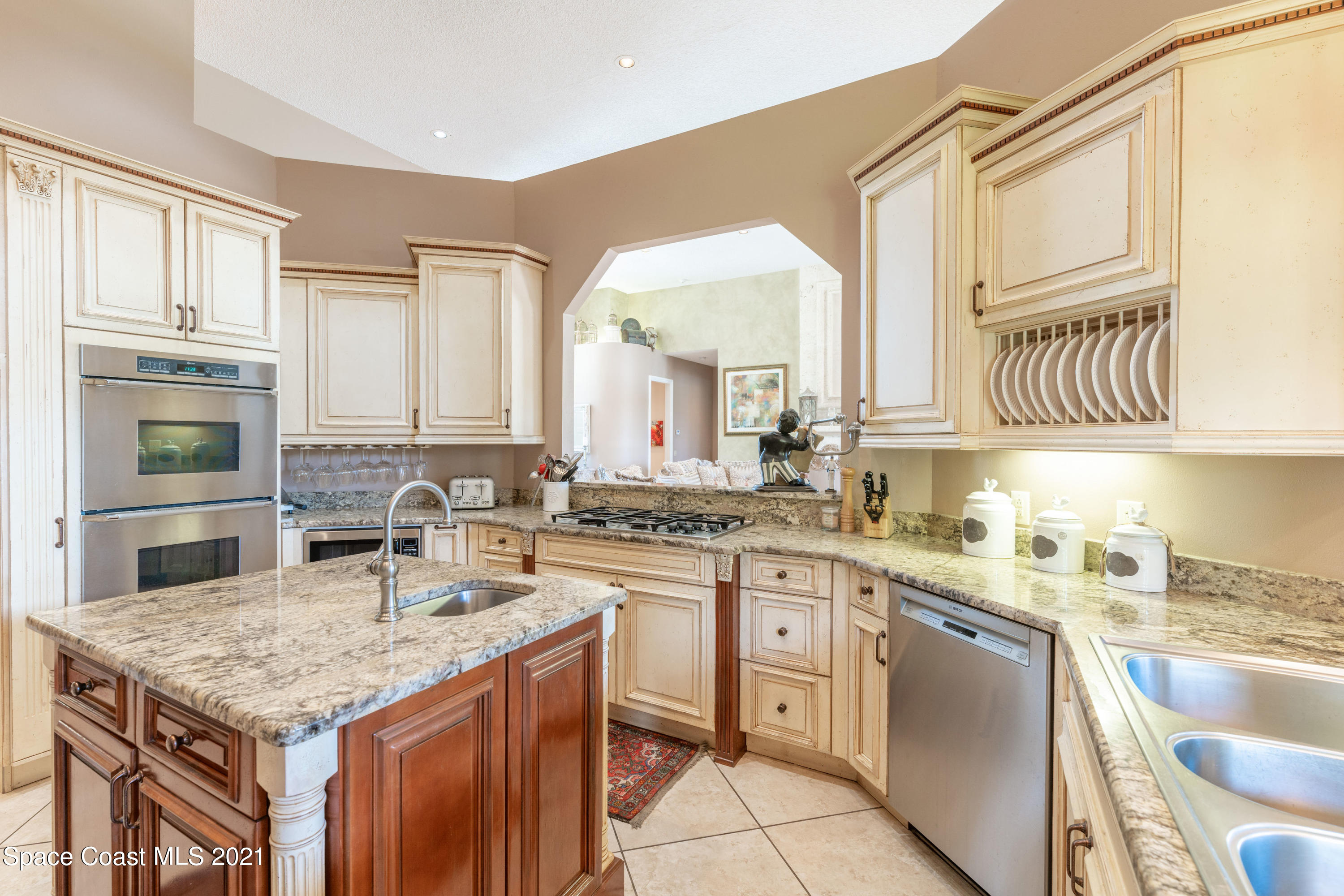 3835 Raney Road Titusville, FL 32780 - Photo 20 of 55 a kitchen with a sink stove and cabinets