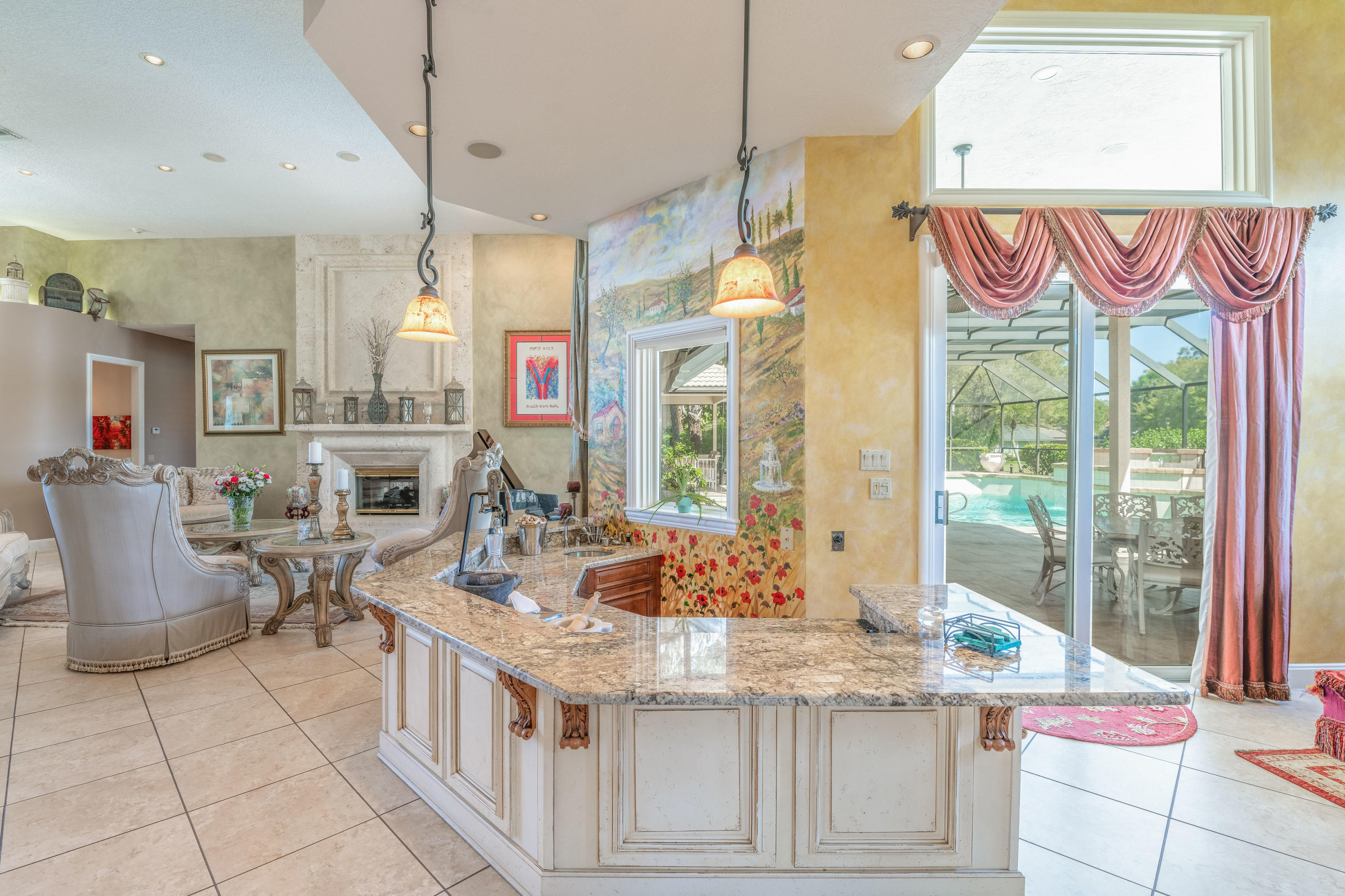 3835 Raney Road Titusville, FL 32780 - Photo 26 of 55 a kitchen with stainless steel appliances kitchen island granite countertop a table and chairs
