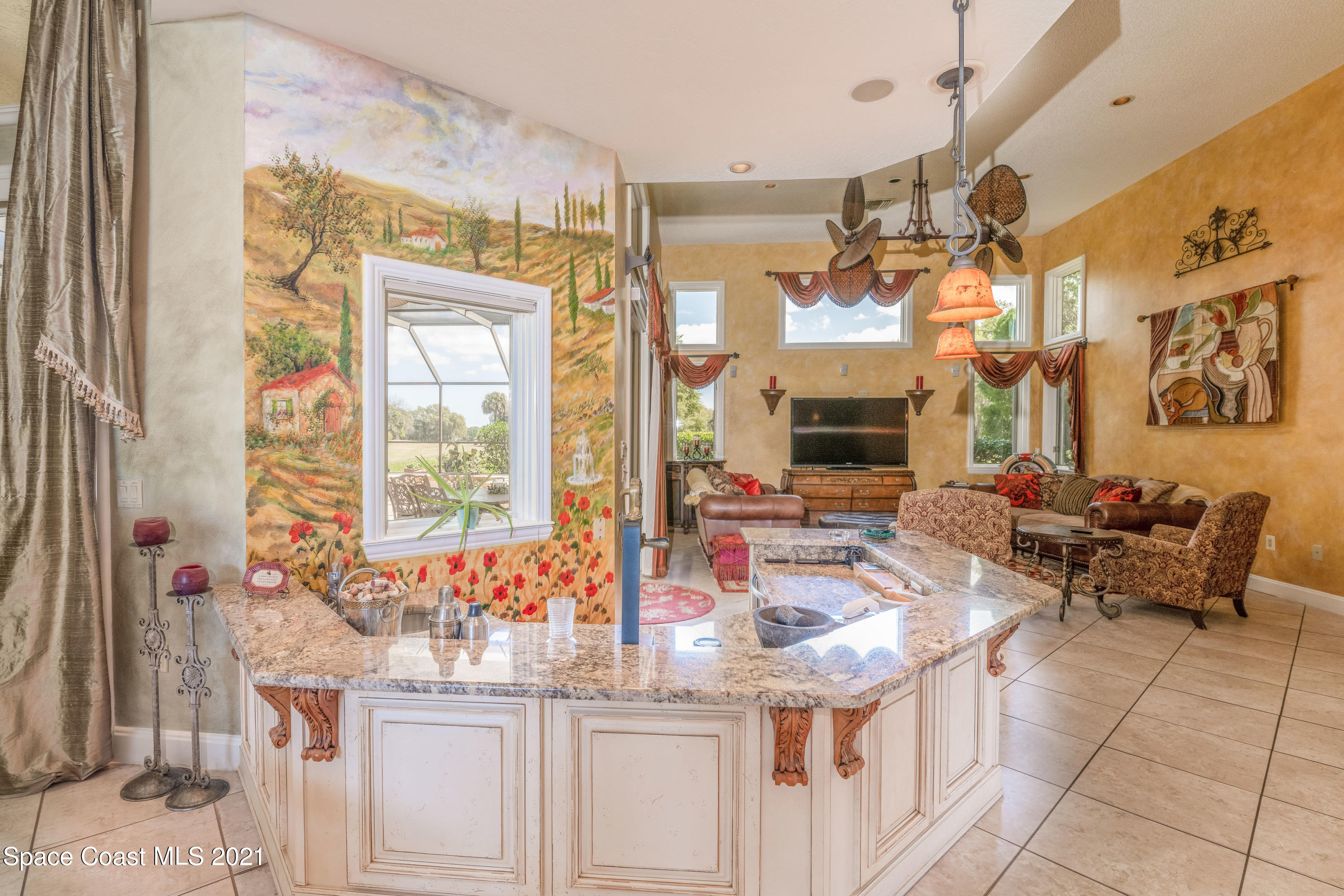 3835 Raney Road Titusville, FL 32780 - Photo 29 of 55 a dining hall with granite countertop a sink and a large mirror