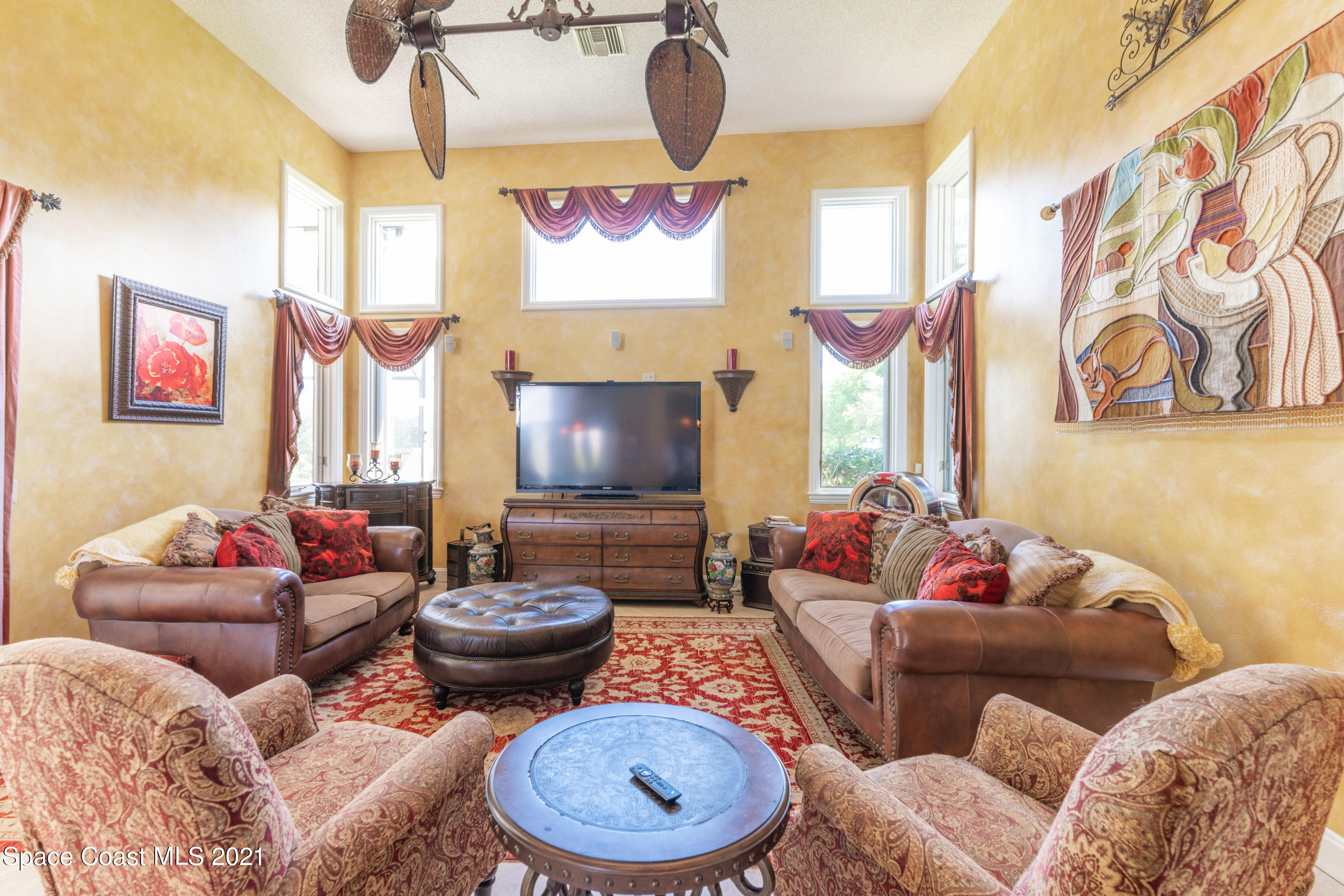 3835 Raney Road Titusville, FL 32780 - Photo 30 of 55 a living room with furniture and a flat screen tv