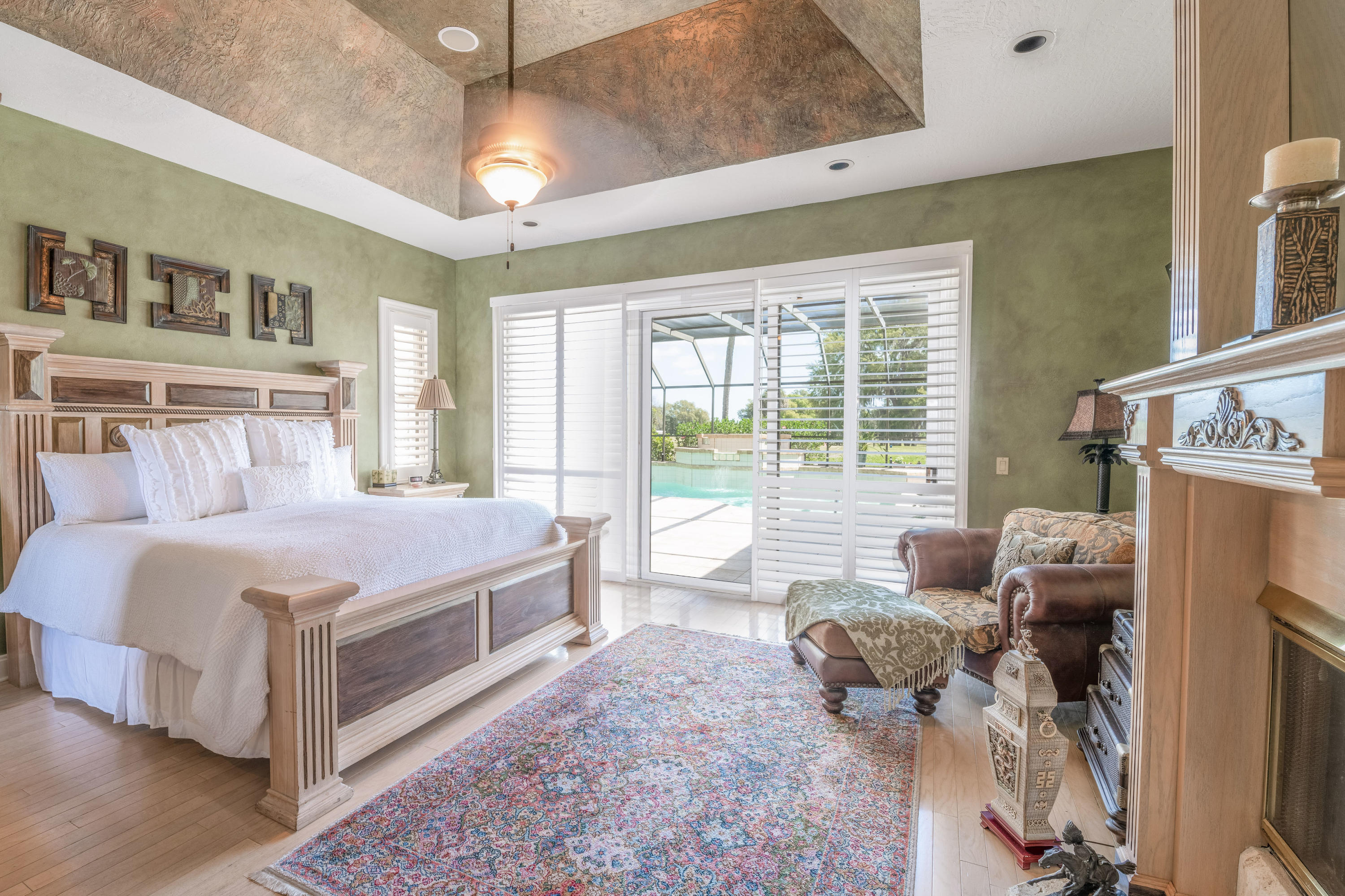 3835 Raney Road Titusville, FL 32780 - Photo 32 of 55 a spacious bedroom with a bed and glass windows