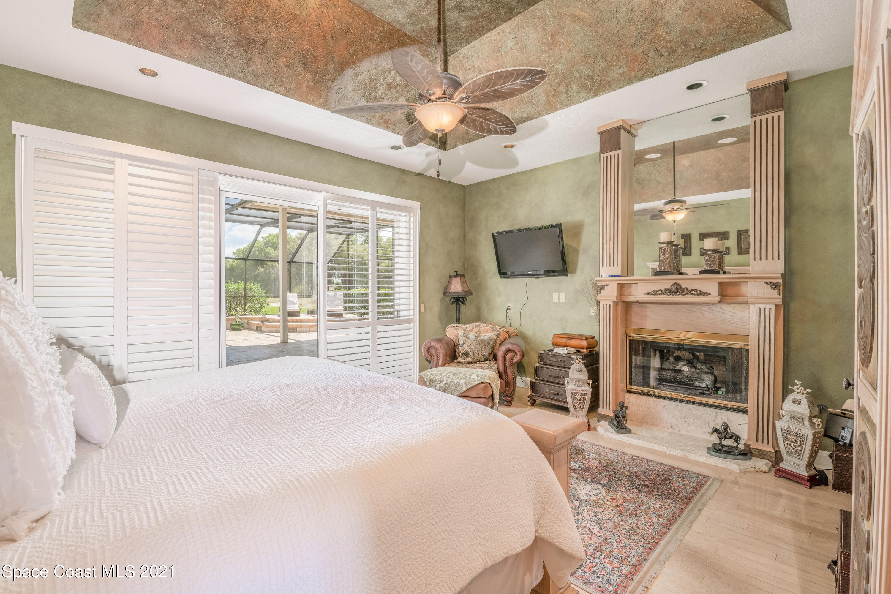 3835 Raney Road Titusville, FL 32780 - Photo 33 of 55 a bedroom with a bed and a fireplace