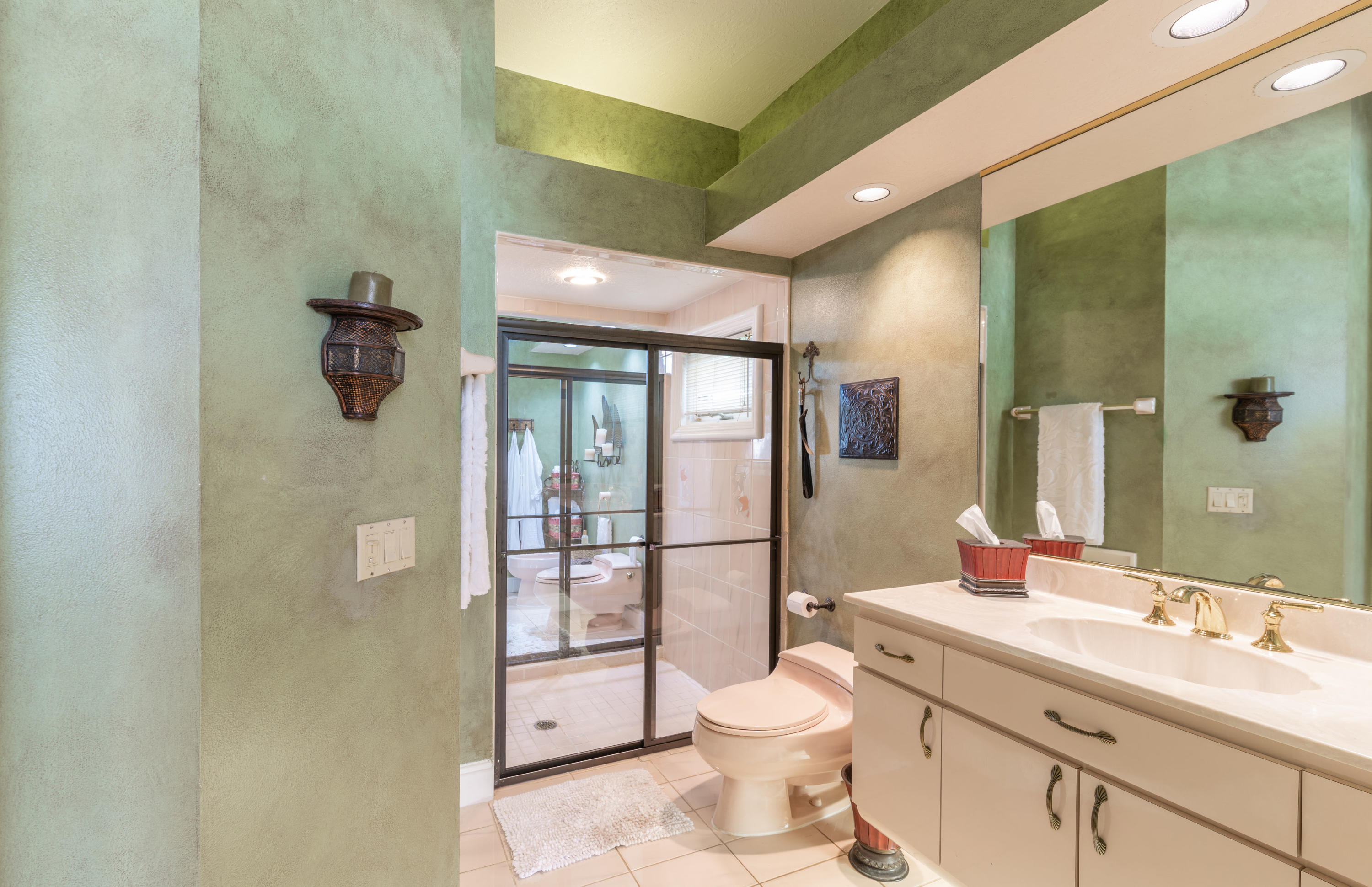 3835 Raney Road Titusville, FL 32780 - Photo 34 of 55 a bathroom with a toilet sink double vanity and mirror