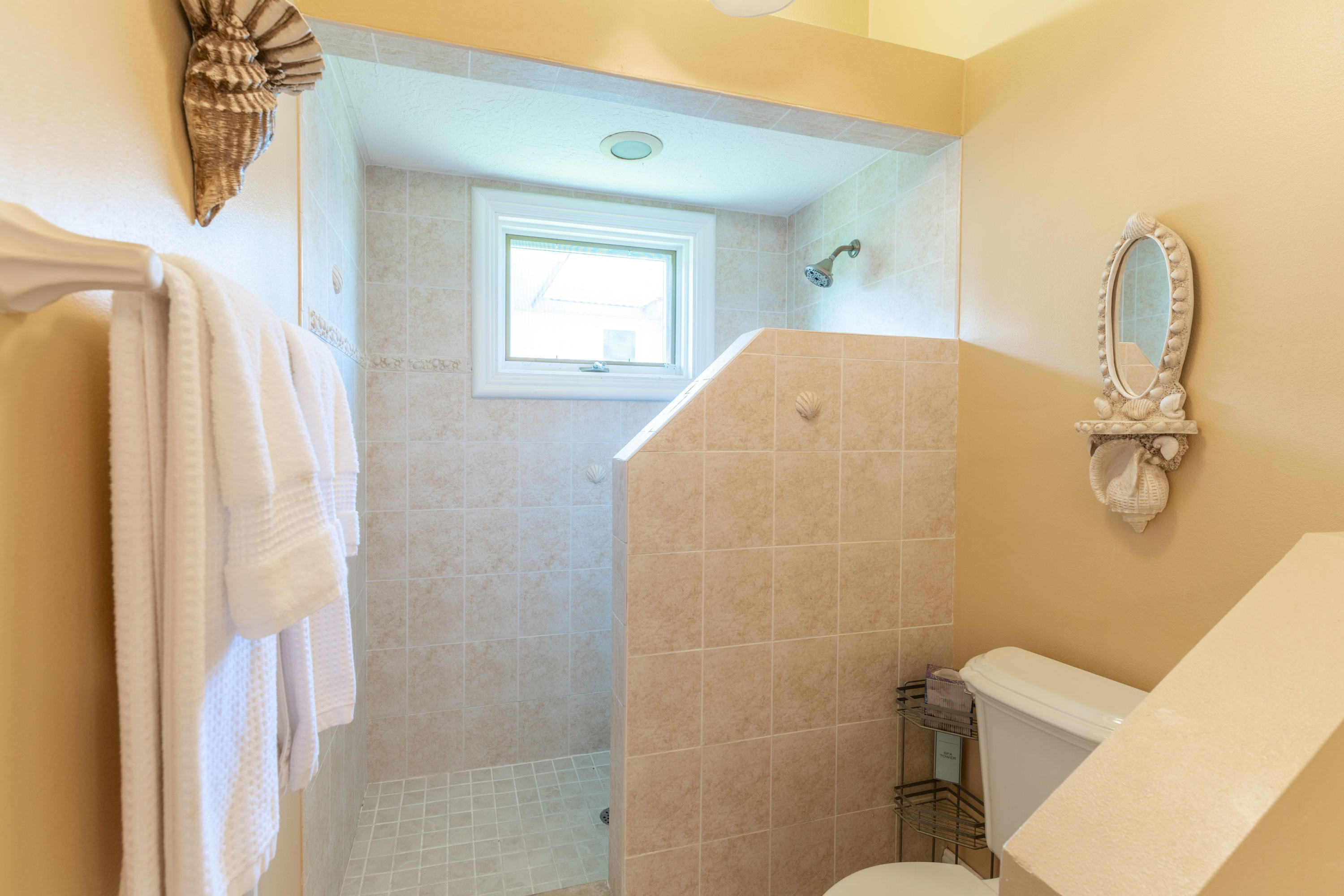 3835 Raney Road Titusville, FL 32780 - Photo 42 of 55 a bathroom with a toilet sink and shower