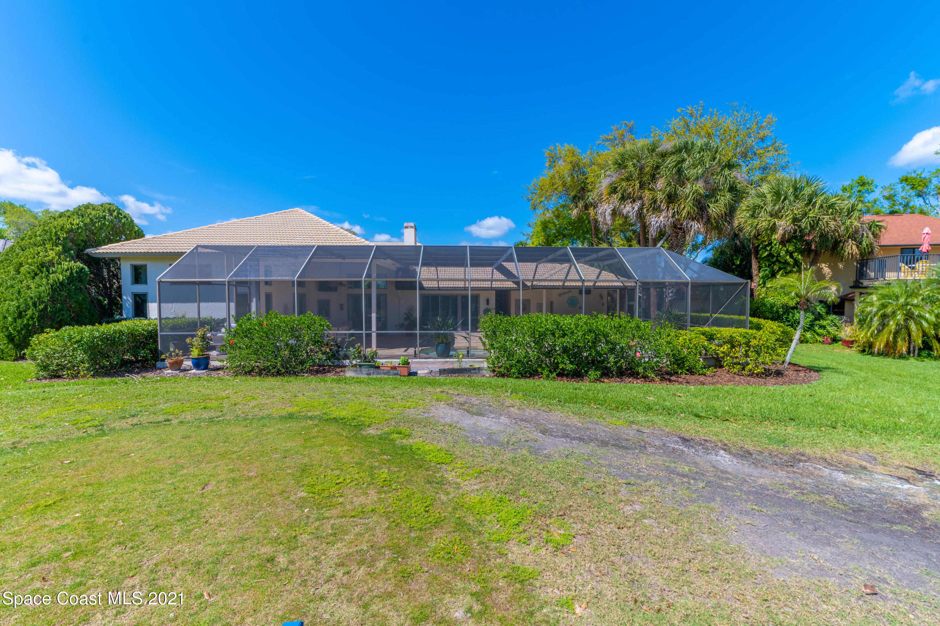 3835 Raney Road Titusville, FL 32780 - Photo 50 of 55 a view of a house with a yard and sitting area