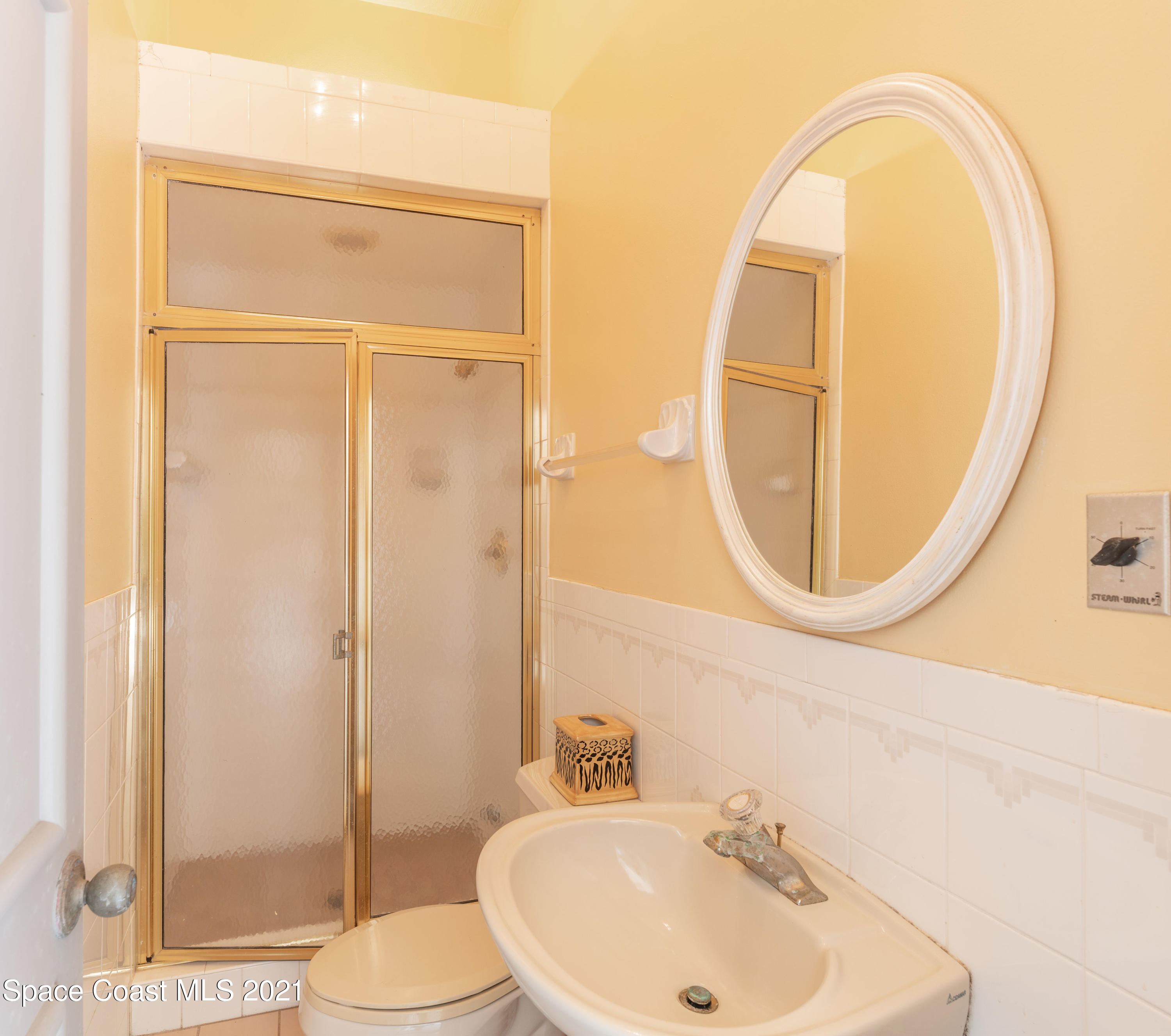 3835 Raney Road Titusville, FL 32780 - Photo 53 of 55 a bathroom with a sink and a mirror