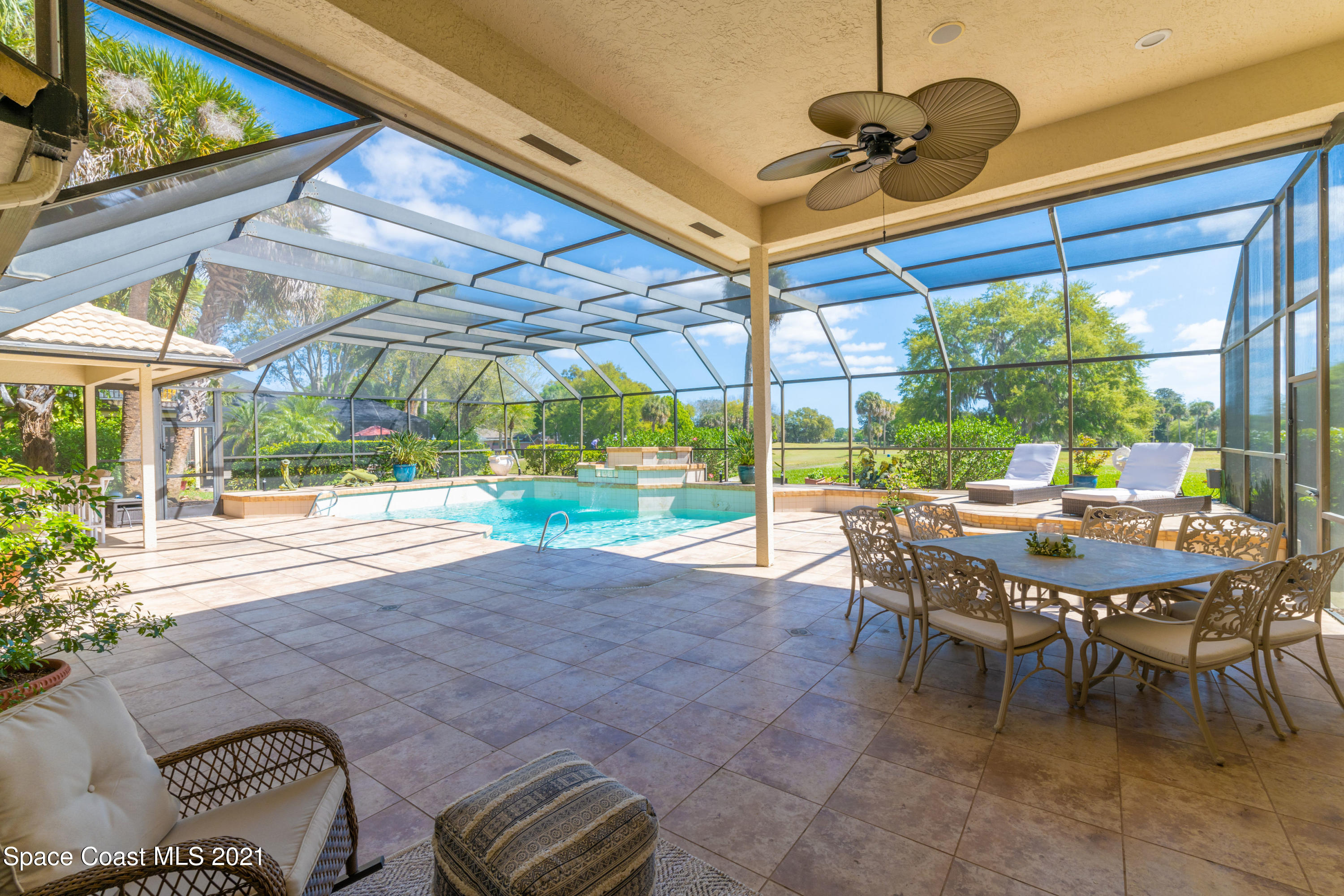 3835 Raney Road Titusville, FL 32780 - Photo 7 of 55 a view of a patio with a table and chairs