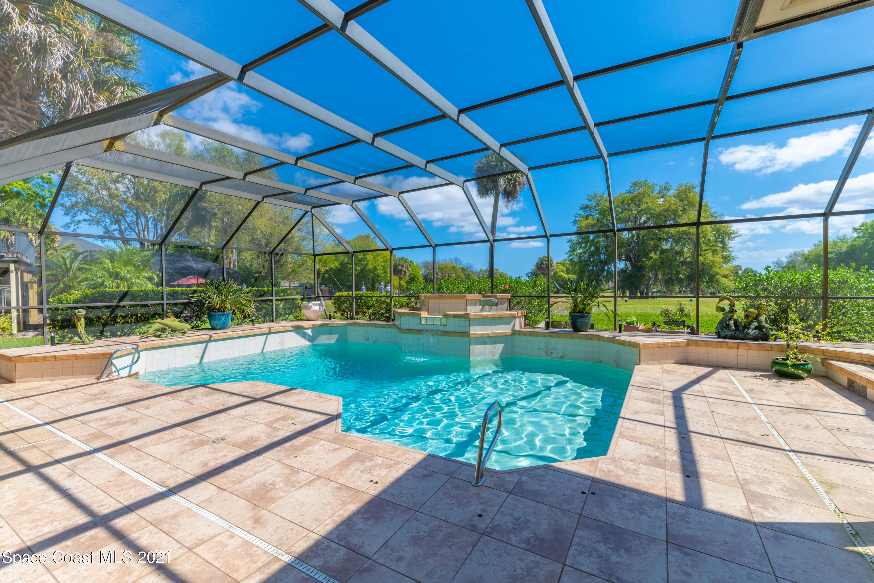 3835 Raney Road Titusville, FL 32780 - Photo 9 of 55 a view of a swimming pool with a patio