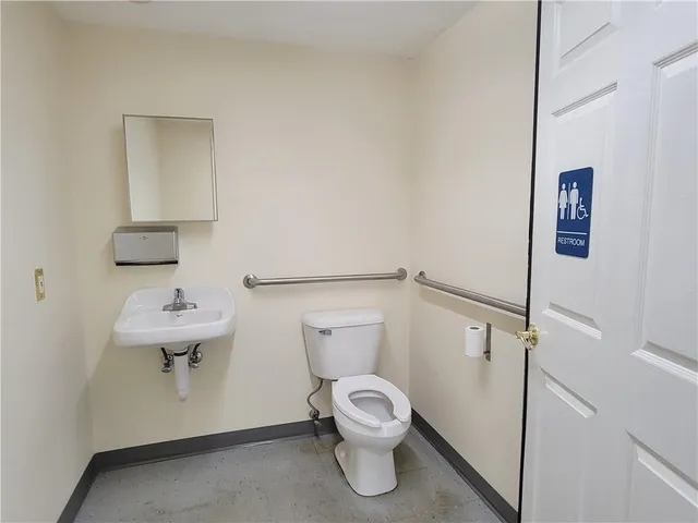 a bathroom with a toilet and a sink
