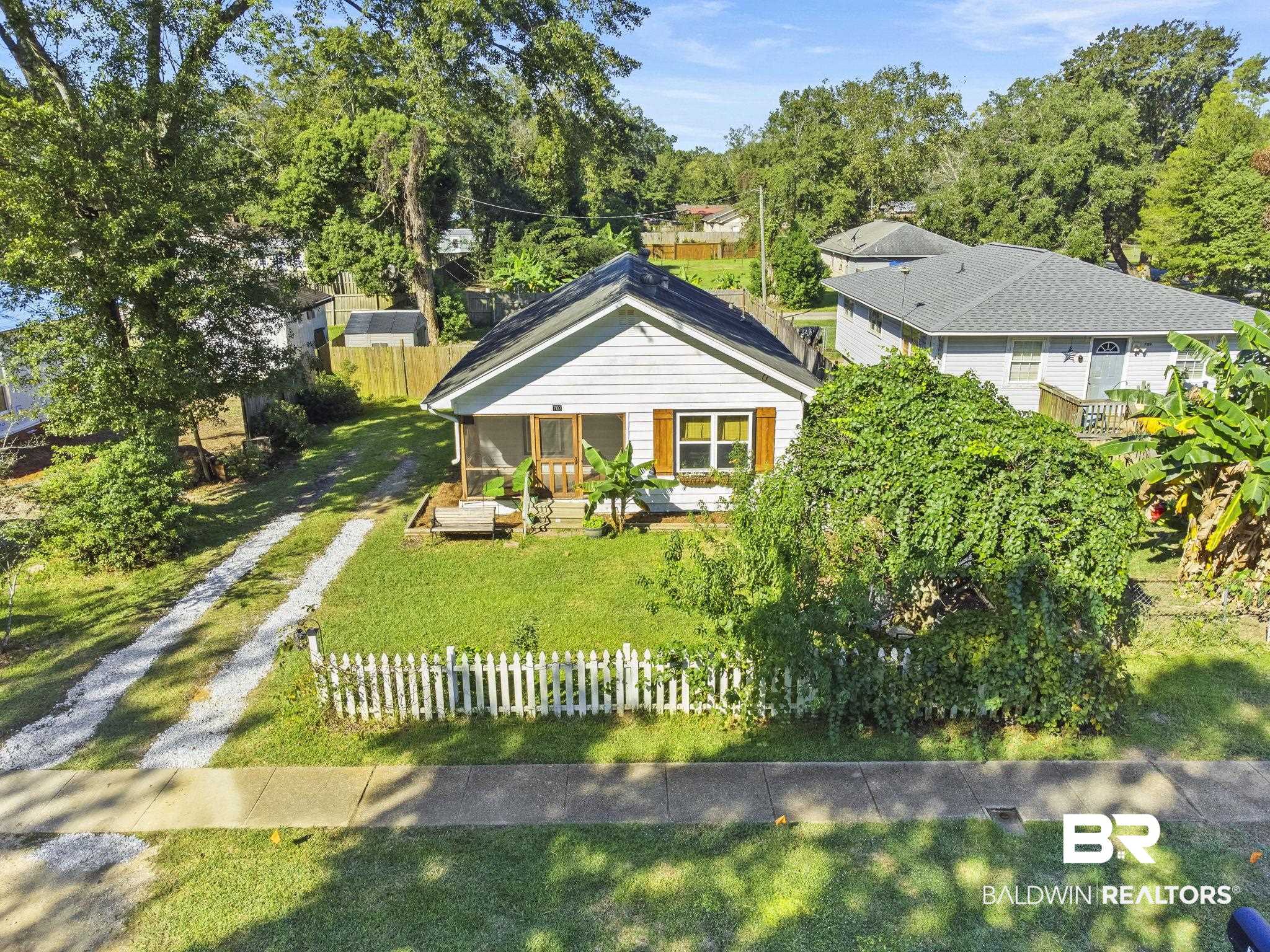 707 North Cedar Street Foley, AL 36535 - Photo 49 of 69 View of front facade featuring a front lawn