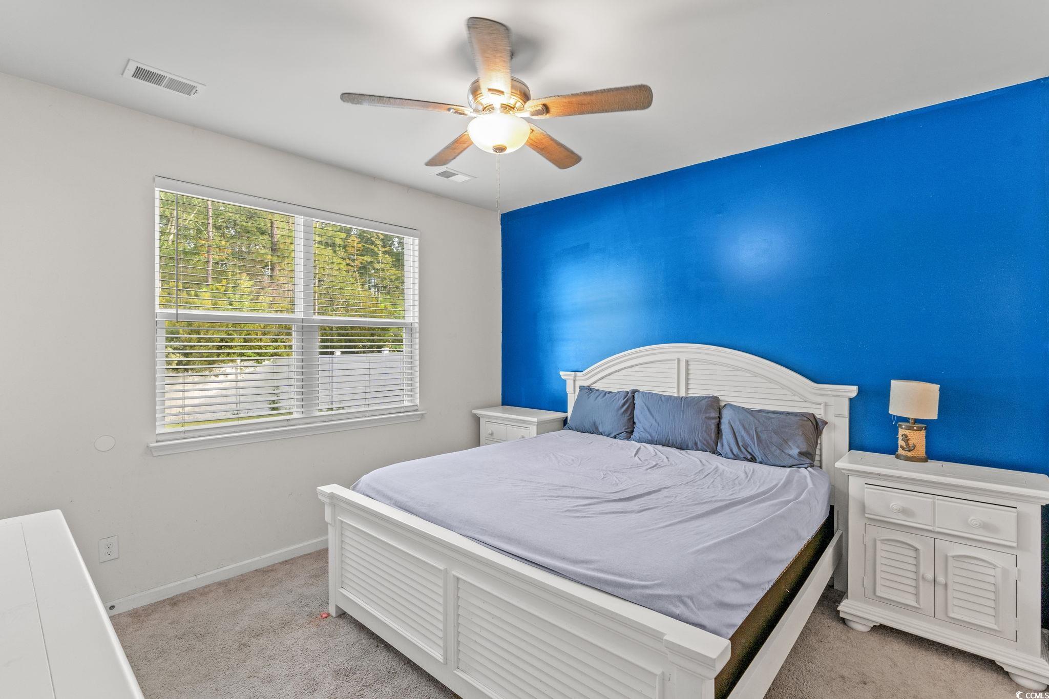 236 Legends Village Loop Myrtle Beach, SC 29579 - Photo 10 of 23 Bedroom featuring light carpet and ceiling fan