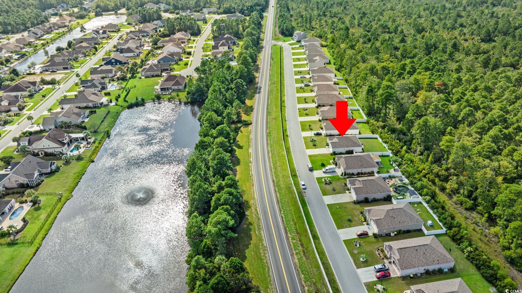 236 Legends Village Loop Myrtle Beach, SC 29579 - Photo 20 of 23 Aerial view of residential area with a large body of water