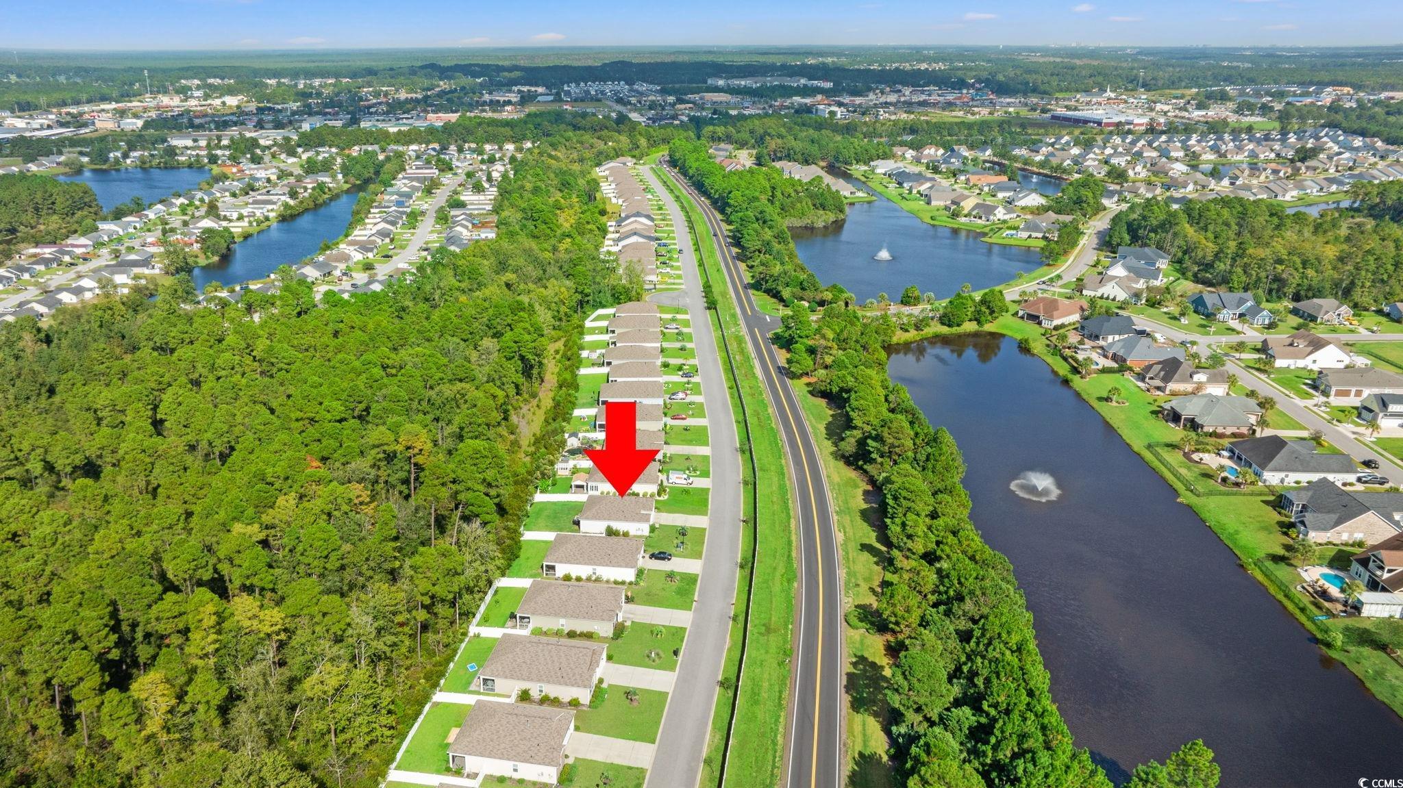 236 Legends Village Loop Myrtle Beach, SC 29579 - Photo 22 of 23 Aerial view of property's location featuring a large body of water and nearby suburban area