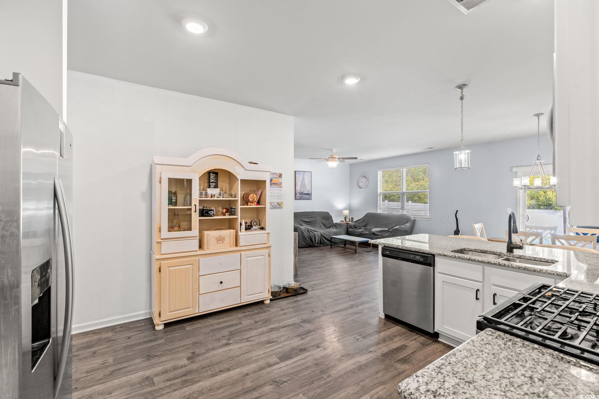 236 Legends Village Loop Myrtle Beach, SC 29579 - Photo 23 of 23 Kitchen with open floor plan, stainless steel appliances, pendant lighting, a ceiling fan, and dark wood-type flooring