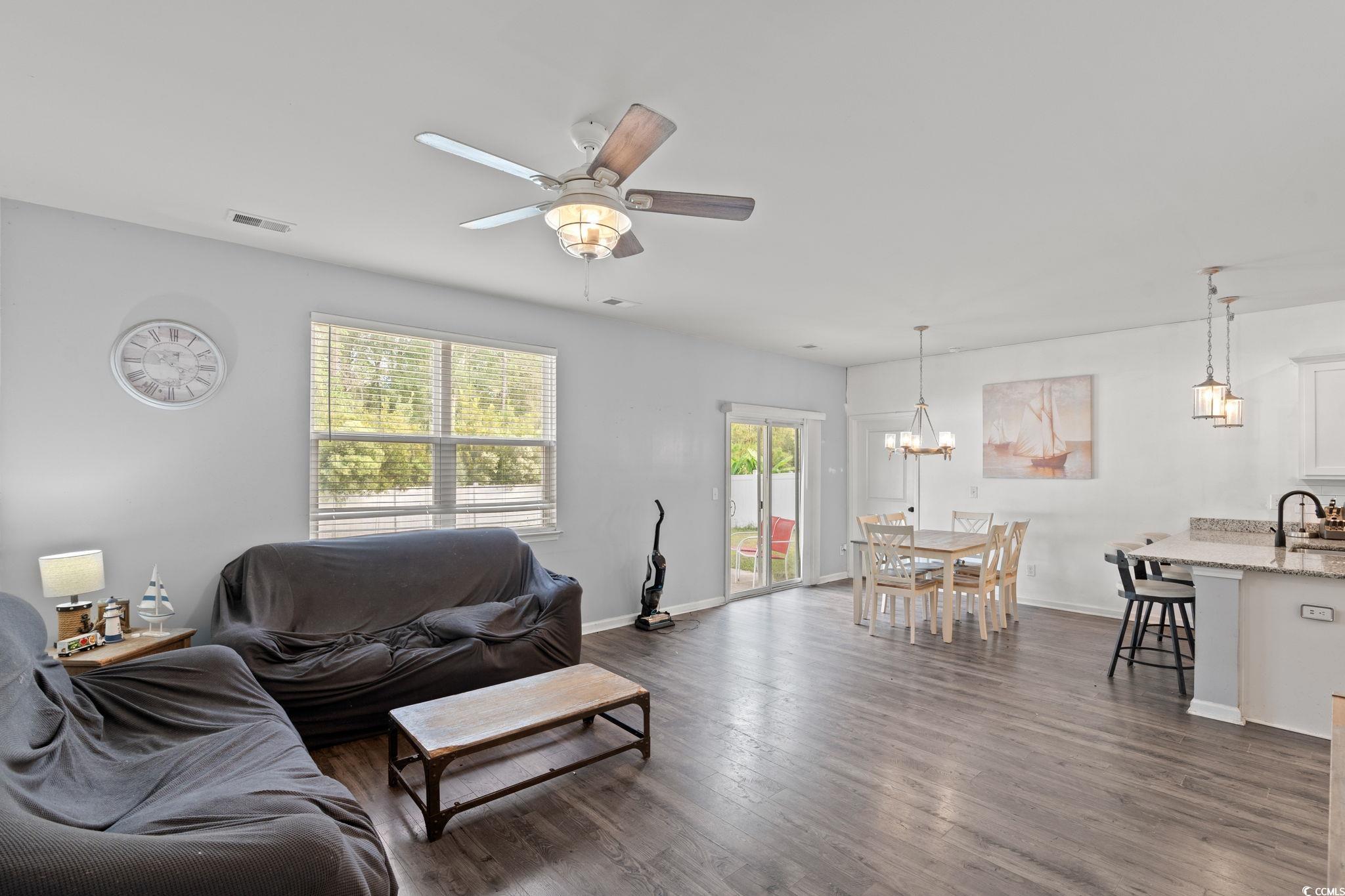 236 Legends Village Loop Myrtle Beach, SC 29579 - Photo 9 of 23 Living area with dark wood-style flooring and a ceiling fan