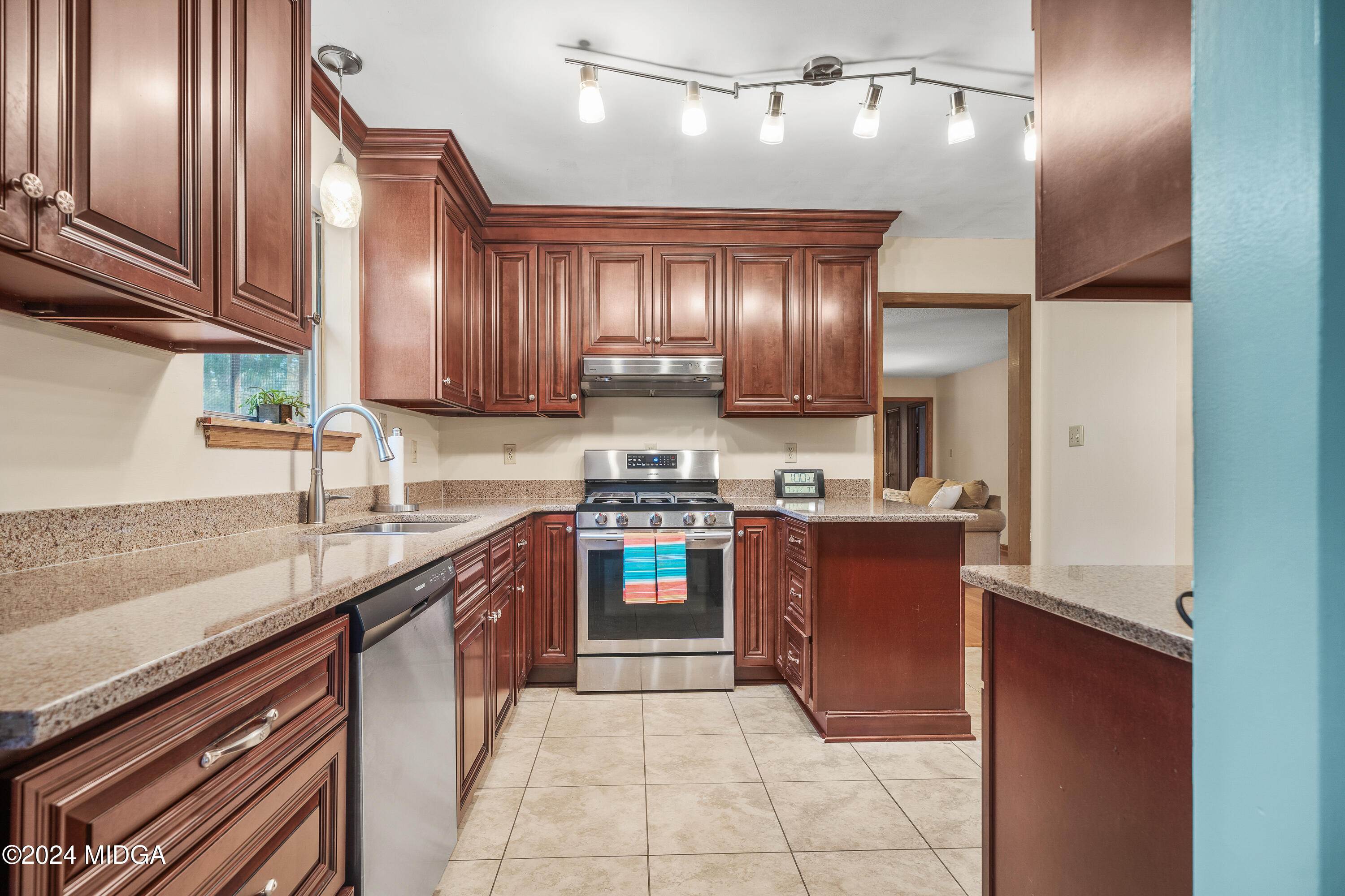112 Whitehead Place Gray, GA 31032 - Photo 13 of 36 a large kitchen with stainless steel appliances granite countertop a sink stove and refrigerator
