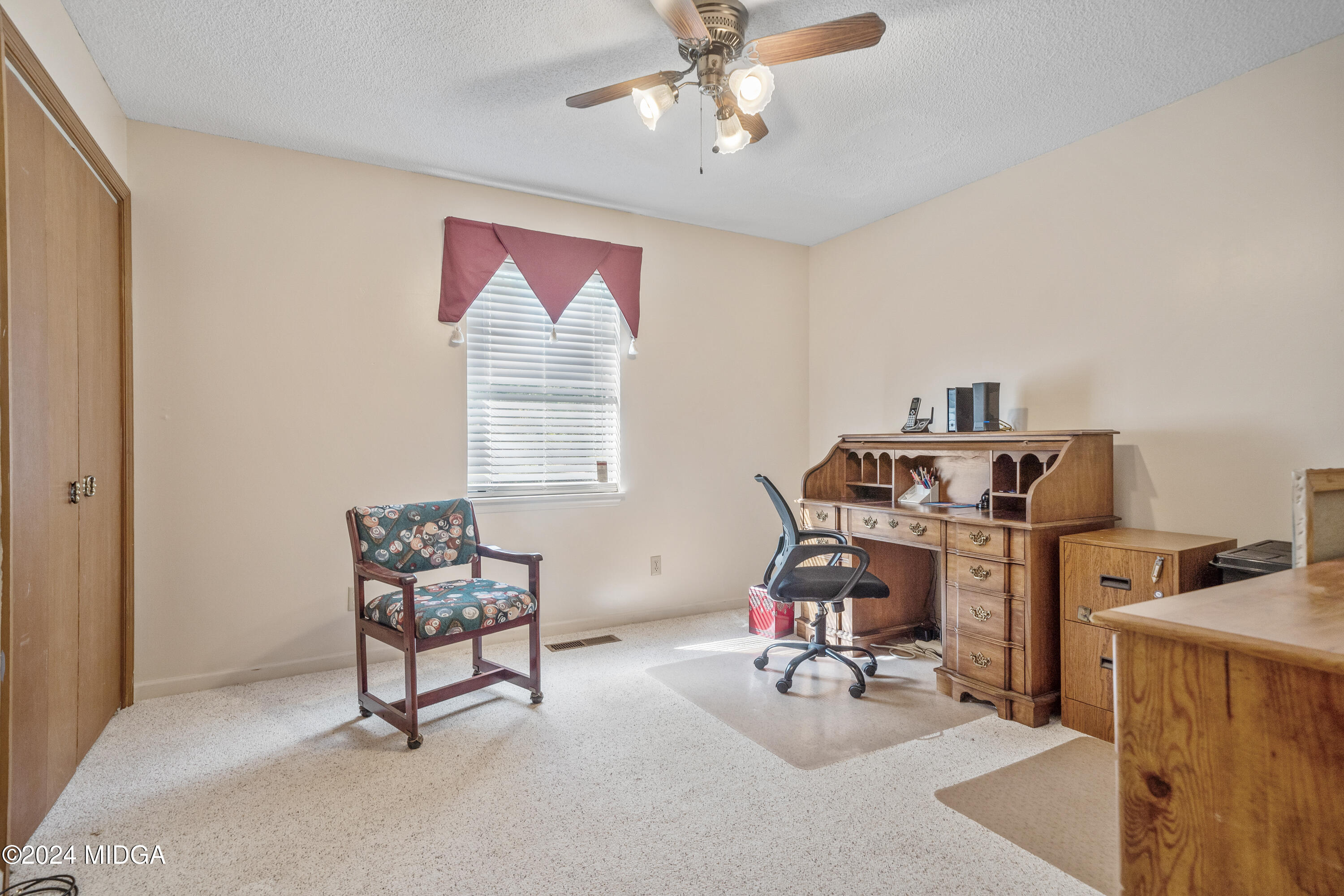 112 Whitehead Place Gray, GA 31032 - Photo 17 of 36 a view of a workspace with furniture and a window