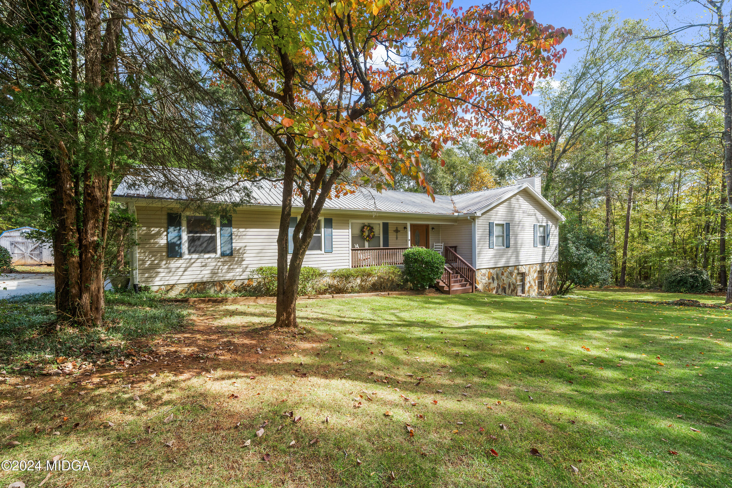 112 Whitehead Place Gray, GA 31032 - Photo 2 of 36 a front view of a house with a yard