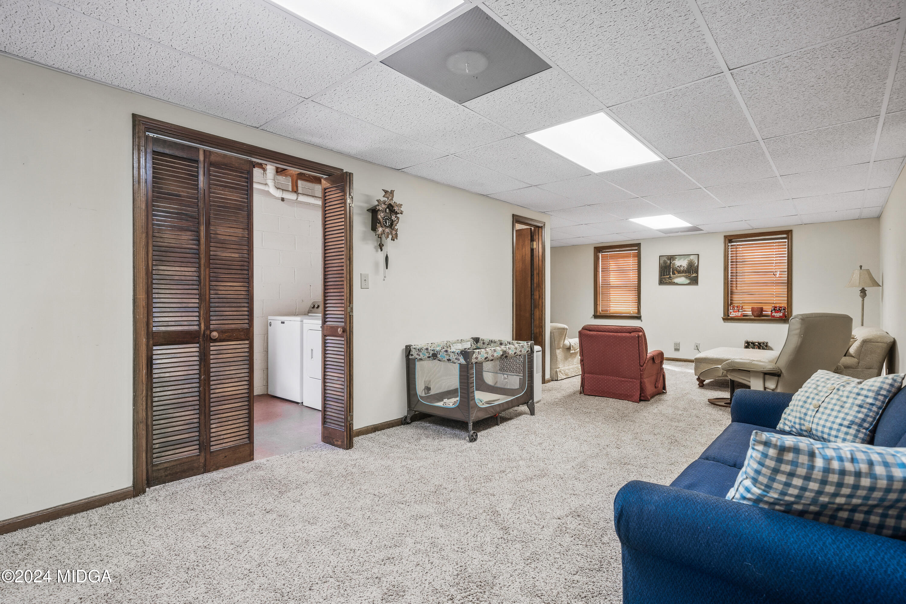 112 Whitehead Place Gray, GA 31032 - Photo 28 of 36 a living room with furniture and a window
