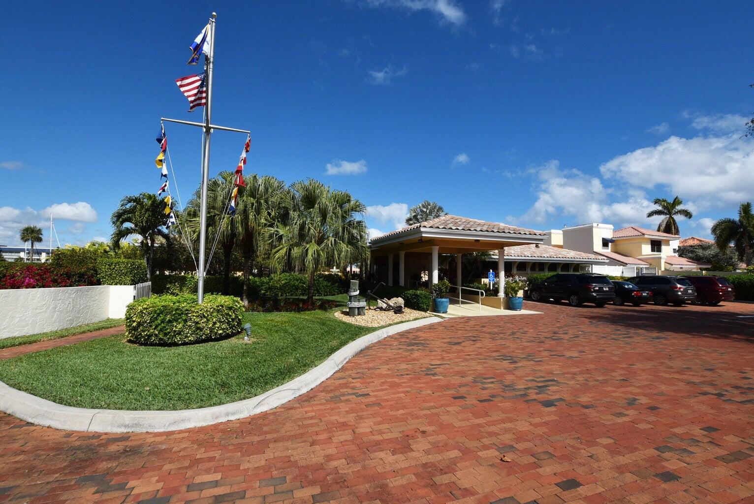 3567 Commodore Circle Delray Beach, FL 33483 - Photo 69 of 76 a front view of a house with a yard