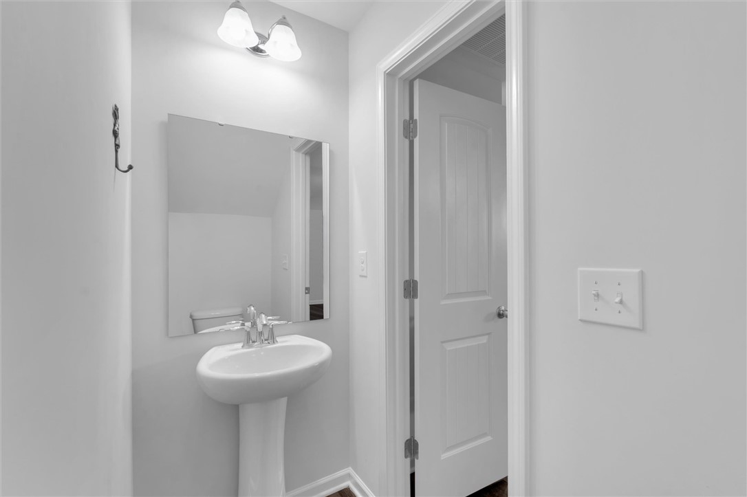 215 Royal Way Pendleton, SC 29670 - Photo 14 of 33 This main floor clean and inviting powder room provides essential convenience for guests and residents alike.