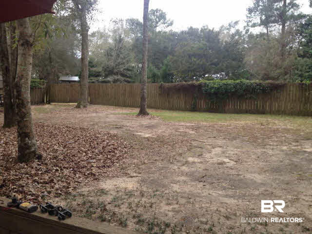 111 Woodside Drive Daphne, AL 36526 - Photo 24 of 31 The large backyard is fenced and has a 50' green space that offers you additional privacy
