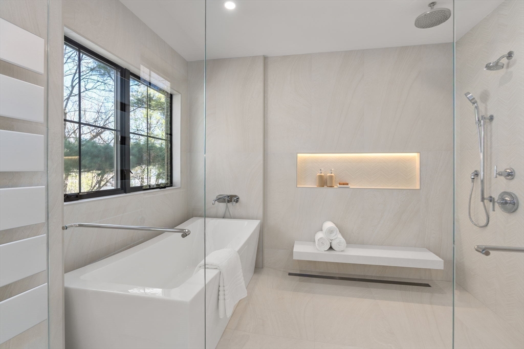 470 Quinobequin Road Newton, MA 02468 - Photo 21 of 37 a bathroom with a sink and bathtub