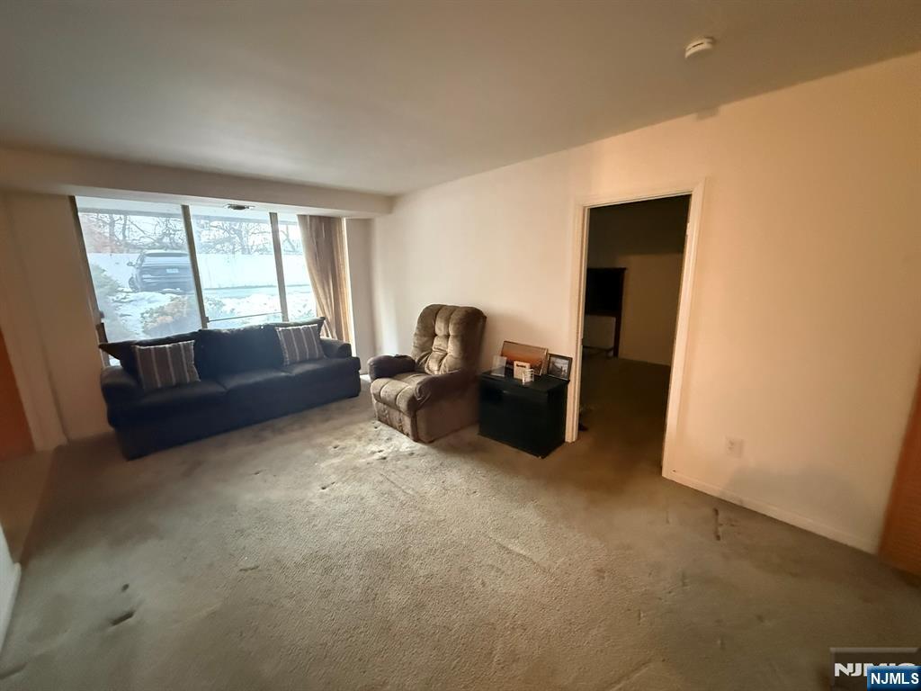 462 River Road, Unit C Nutley, NJ 07110 - Photo 6 of 10 a living room with furniture and a window