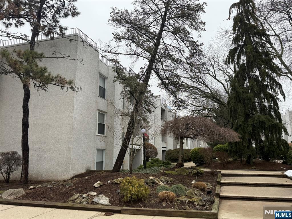 462 River Road, Unit C Nutley, NJ 07110 - Photo 9 of 10 a front view of a house with a yard